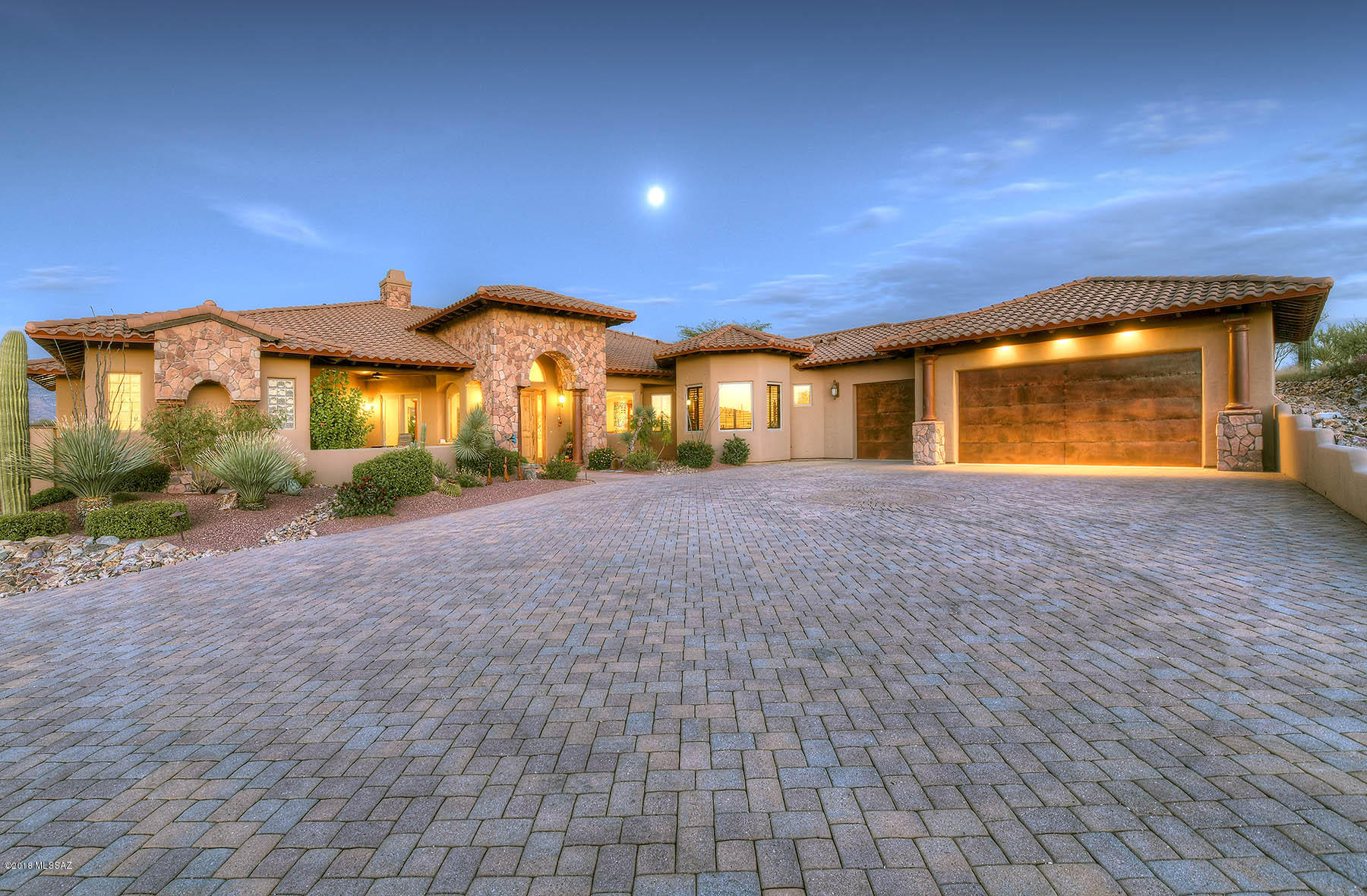 Sensational one of a kind southwest contemporary built in 2007 on 6.87 acres in gated Coyote Creek.  Lot offers unobstructed panoramic mountain views and backs to hundreds of unbuildable acres of state land.  You'll find unparalleled construction, quality and attention to detail in this 4569 sqft main house and the 3474 sqft unattached hobbyist garage built to accommodate numerous vehicles, RV, and could be converted to a guest house.  Some amenities include; stone and concrete accents, Viking appliances and new Subzero refrigerator, 1900 sqft patio with outdoor kitchen, electric disappearing window wall, Anderson windows, alder doors, mesquite cabinets...(complete list of amenities available upon request).  
Community has exquisite open space park, recreation and equestrian centers,