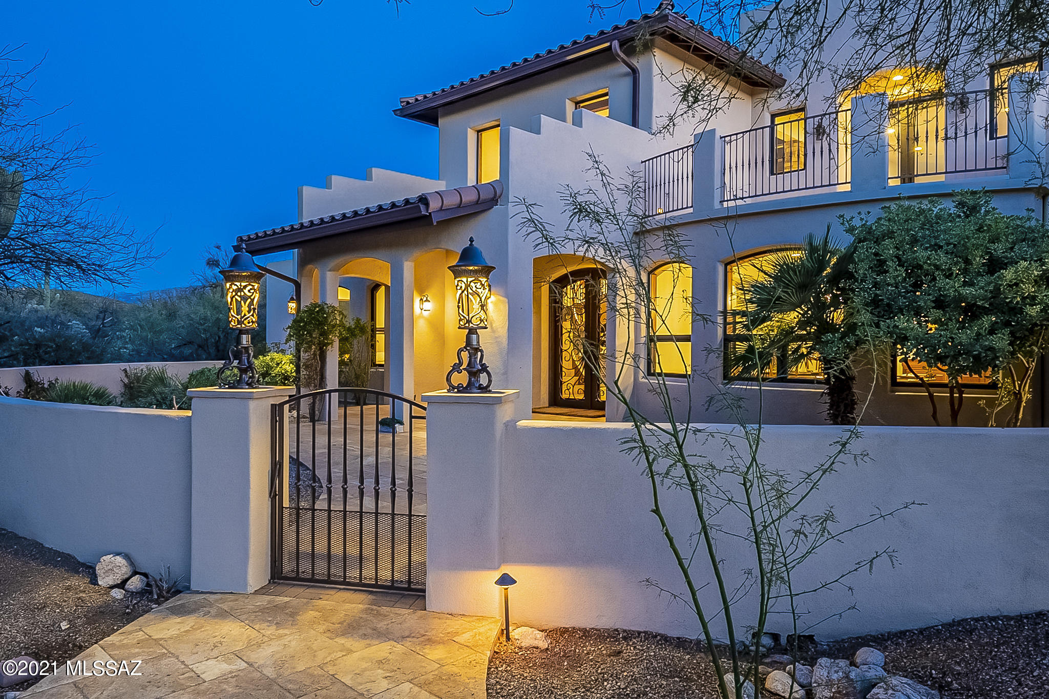 This beautiful house is a custom built Mediterranean home with majestic 360 views. This 2009 home is constructed from masonry and steel framing. The house is 4,927 sq. ft. sitting on 3.37 acres. The outdoor living areas feature 2 private balconies and 2 large covered patios with travertine floors. It has a wonderfully landscaped backyard featuring a BBQ grill, fire pit, pavers, and a rectangular pool. Inside the home it consists of high ceilings with wooden beams, a large custom steel staircase, 8 ft. stained alder solid doors, travertine and hardwood stained alder floors throughout. Gourmet kitchen is furnished with Wolf appliances, 2 built in refrigerators, granite countertops, built in mini drinks cooler, and a mini bar. Home has an oversized 4 car garage and central sound system. This energy efficient home comes with updated HVAC systems, water heater, and a large 12.21 kWp solar system which helped keep electricity bills relatively low at $145 a month on average for the year 2020 (Electricity bills may vary based on usage). Solar system is fully owned. OWNER IS A LICENSED REAL ESTATE AGENT IN ARIZONA.