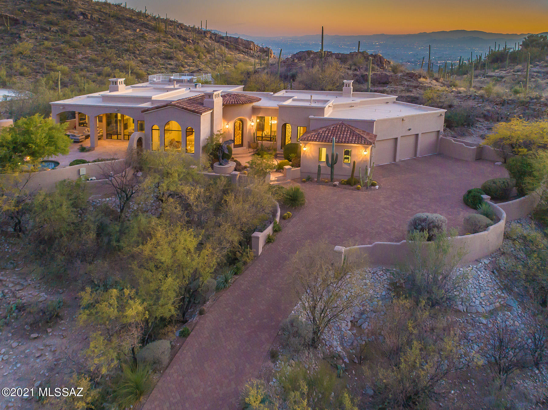Stunning transitional home sited on 1.81-acres in prestigious guard gated community in the Canyons is now available for the discerning Buyer. Majestic outdoor eagle statue greets you as you enter architectural bronze front door into foyer w/ dome ceiling. Home boasts massive stone FP in LR w/ unobstructed canyon views. Chef's kitchen w/ granite countertops, wood paneled SubZero refrigerator & drawers, 2 Asko dishwashers, & bar seating for 4 opens to family room & steps away to resort-style backyard w/ pool/spa, built-in BBQ, & beehive FP. Master Suite features 2 master baths, walk-in closets, exercise, & sitting area. Media room off MB boasts built-in cabinets, hardwood floor, & luster stone wall finish. Spectacular city views from observation deck! 3D tour on MLS, photos/virtual tour.