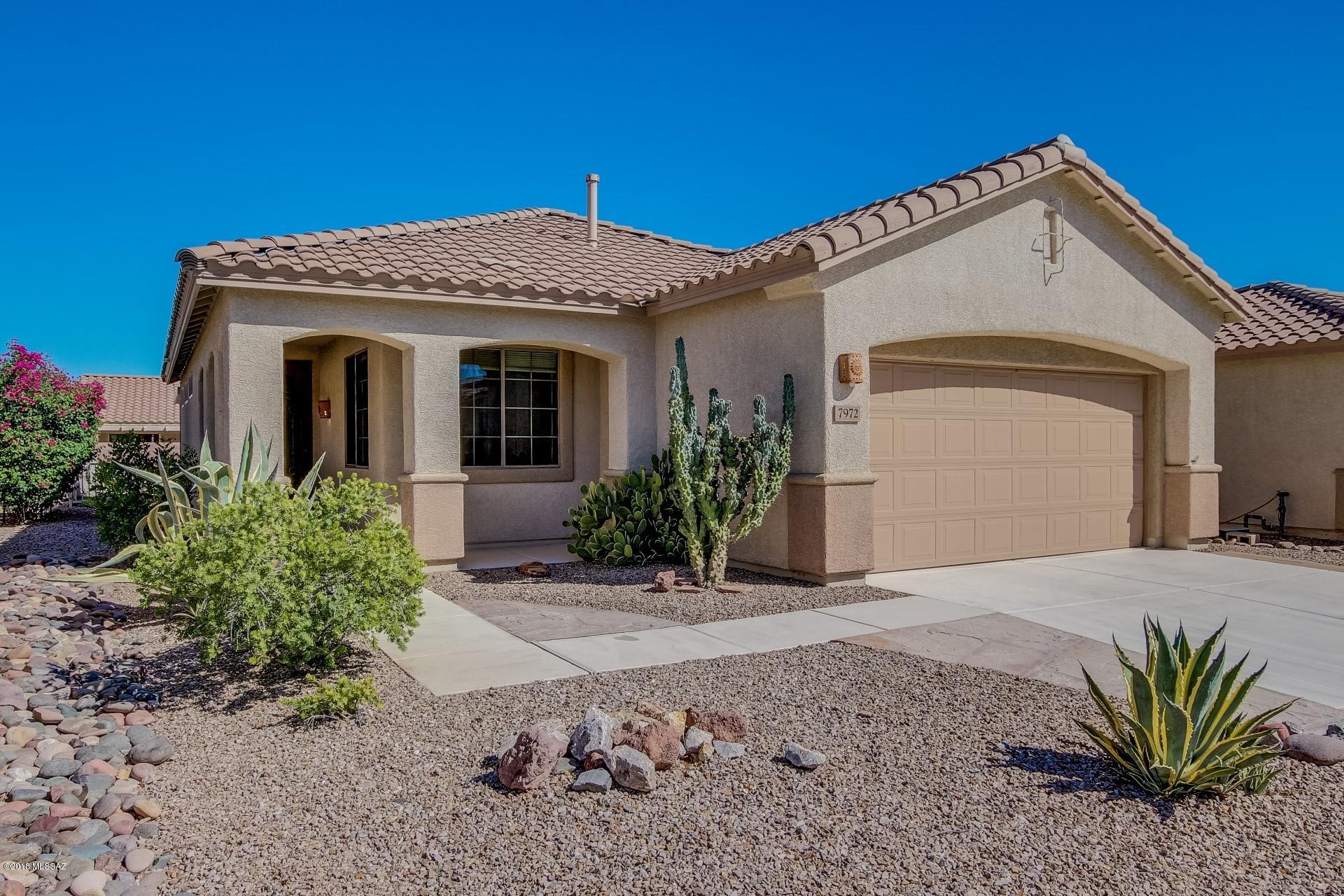 Beautiful Sedona model in Sunflower with tile flooring in the great room, kitchen and baths, screened-in patio, custom wrought iron security door, 2 bedrooms and a den. Master bath includes dual sinks and walk-in shower. Extended 2-car garage with cabinets. This home shows like a model, don't miss it!