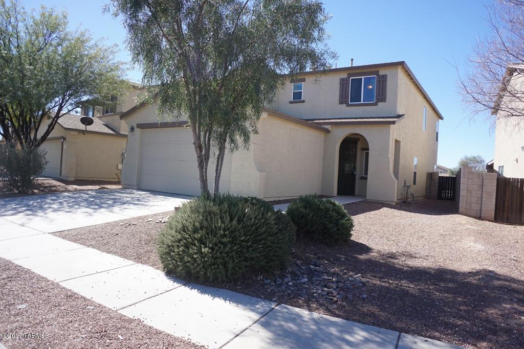 Beautiful 2-Story, 4 Bdrm/2.5 Bath freshly painted and new carpet! Open Living room off separate formal dining room. Half bath downstairs, nice Family room off kitchen with Island and breakfast area. Spacious master suite with large walk-in closet. Ceiling fans throughout. Low care landscape, backyard with citrus trees, covered patio with extended pavers, perfect for outdoor entertaining. Washer/dryer in laundry room, Sunnyside Schools, 2 Car Garage.
