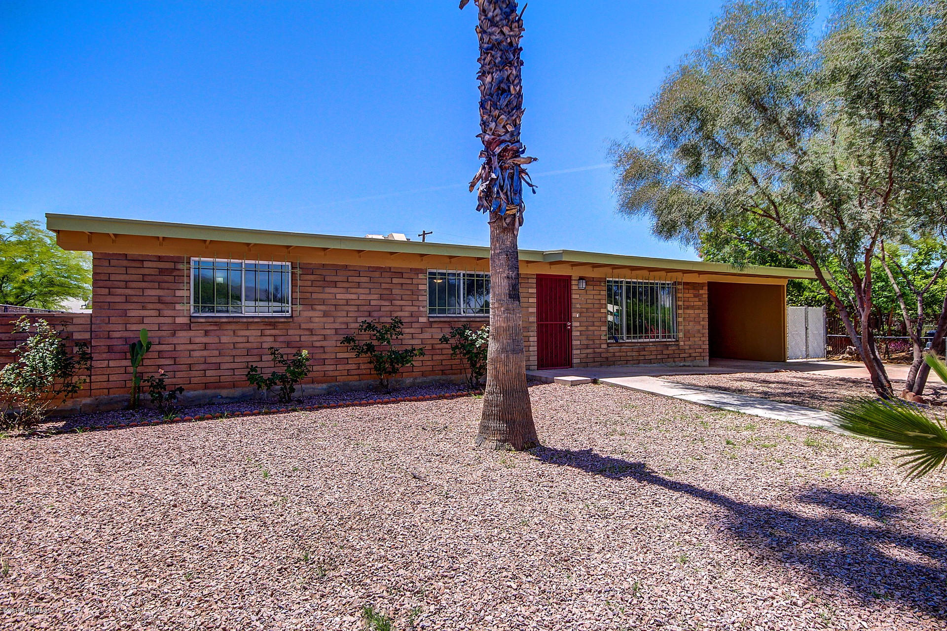 Newly renovated Central Tucson home with separate Man Cave/She Shed/Guest Home! You will fall in love with this open floor plan that features custom paint,picture windows and beautiful tile flooring! Eat in kitchen boasts stainless steel appliances, custom cabinetry, granite counters and a breakfast bar. Each spacious bedroom has plush carpeting. Master bedroom includes an adjoining bath. Both baths have been upgraded with decorative tile surround showers and custom vanities. Generous backyard is complete with a covered patio and meticulous desert landscape. This home is move in ready and waiting for you! See it today and make it yours! Listing agent is a member of selling LLC.