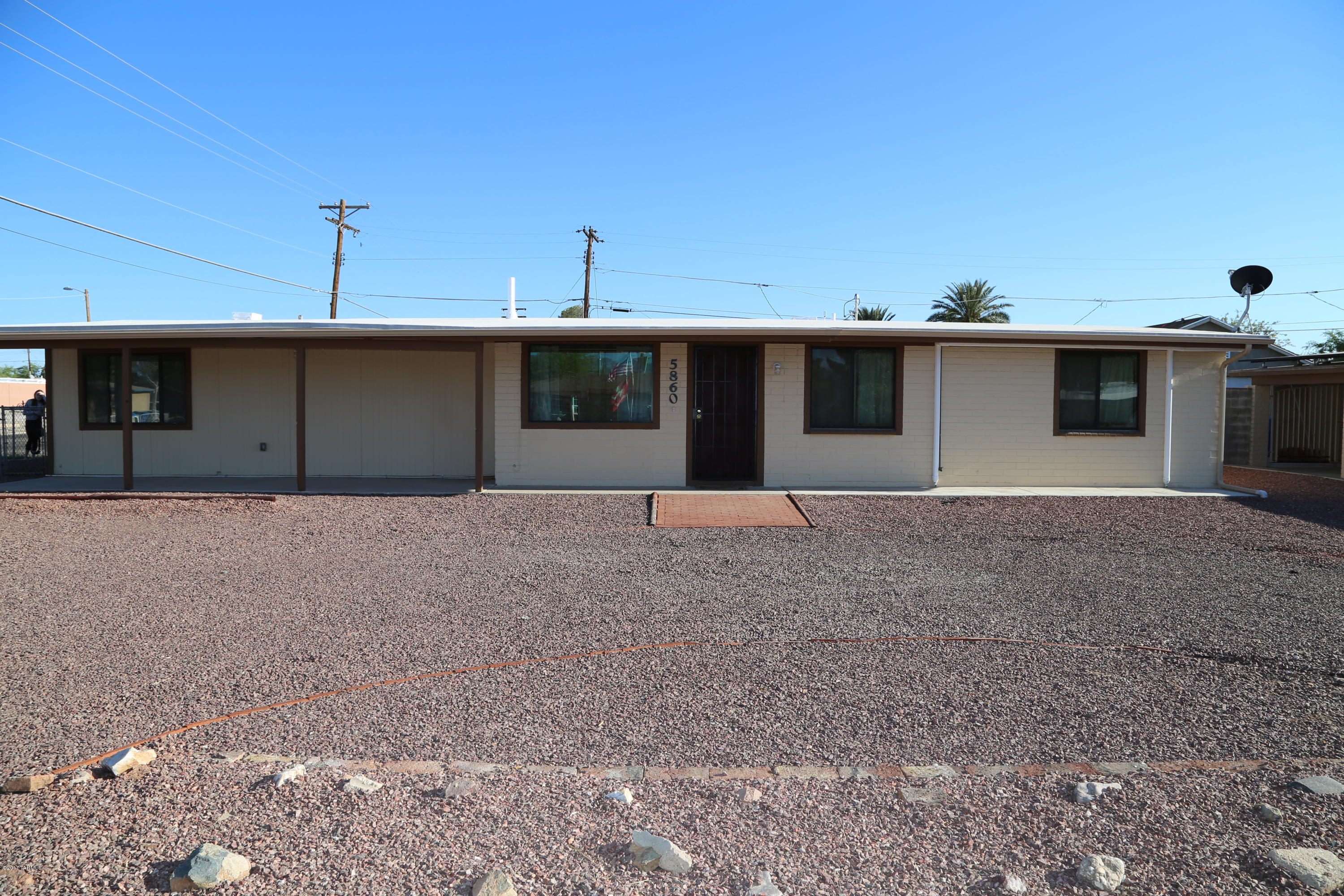 Spacious 4-5 bedroom home with guest quarters/family room on large corner lot.  Separate dining area, large laundry room, custom AC/Heat, and newly coated roof.  Many possibilities and close to Davis Monthan and Golflinks Sports Complex.  Owner/agent.