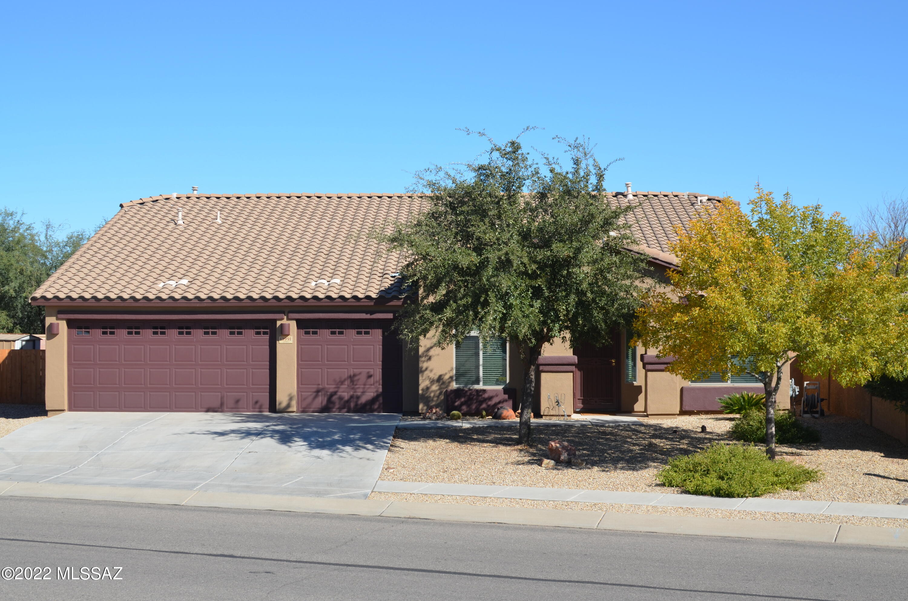 Stunning one of a kind one level.
 3 bedroom and 4th room office/den. Three stall garage, RV parking, stunning living room, dining, great room with entertainment area and large kitchen with granite topped island and counters. Primary is on opposite side from other bedrooms. Office/Den has French doors. Flooring in Great Room and kitchen is newly installed high end Pergo wood faux flooring. Primary suite is stunning with duel vanities, large walk-in shower and sitting area. Outside entertainment area has a Tiki bar, ramada, hot tub, trees and desert plantings. Large gated RV area with access to electricity and water. Recently painted exterior. Located in a a very quiet neighborhood.
So much to say yet so much more. 
Won't last long.
