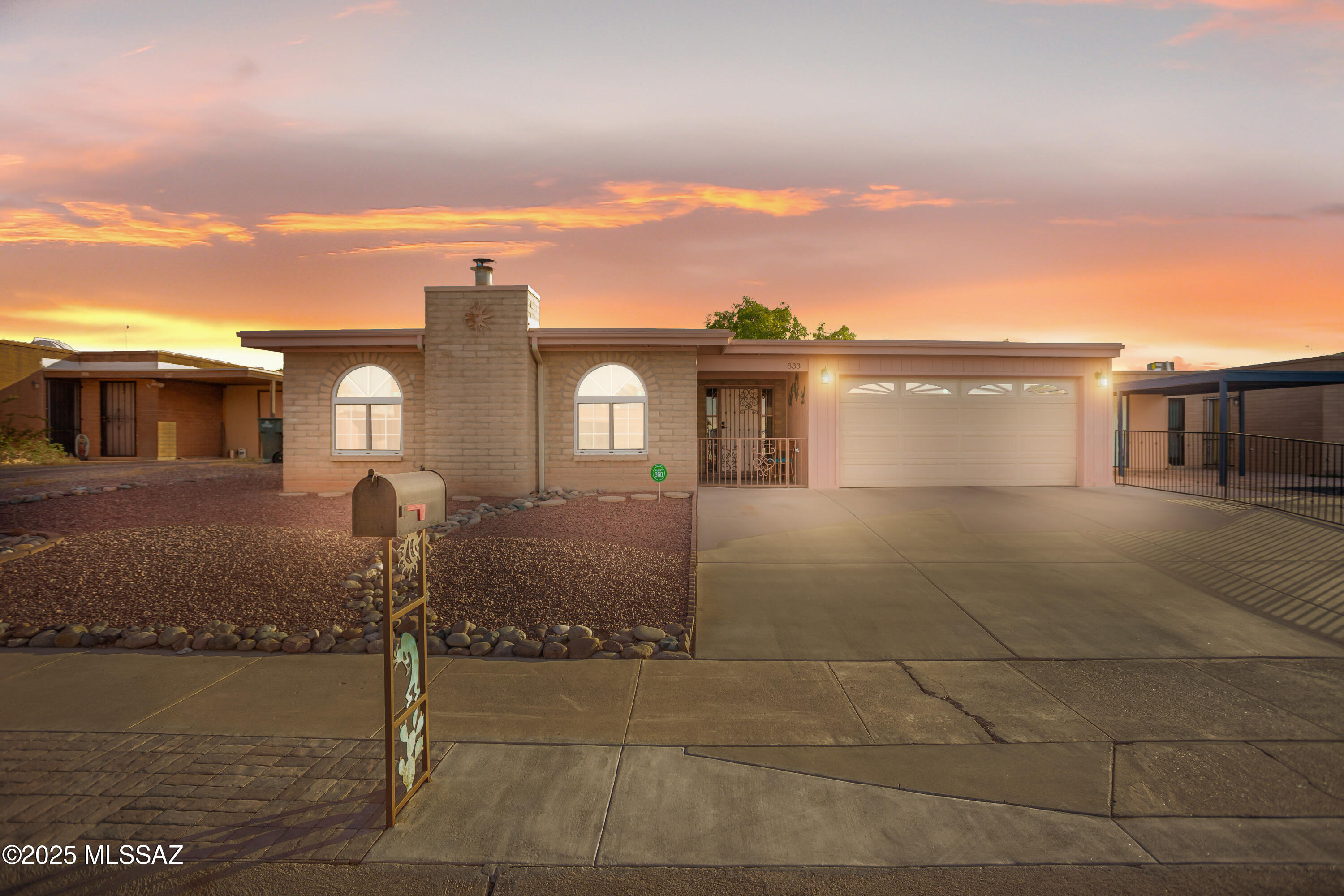 Stunning centrally located home in the heart of Tucson! This turn-key Santa-Fe style immaculately kept residence is ready for its proud new owners. Boasting a fully manicured, low-care, .15 acre lot with no HOA! Secure all your toys with a 3 car extended garage with ventilation. Once inside you'll be welcomed by a foyer, tall vaulted ceilings, large open spaces, ample living room for the family, and a separate dining area. In the kitchen you'll natural wood cabinets, custom LEDs, appliances, and an eat-in island w/ charging ports! The home has many upgrades like Ceramic tile in all main areas, new carpet, remote controlled ceiling fans in all rooms, double pane windows, wired for surround sound, custom rod iron security doors, fully updated bathrooms, and more! The Primary BR has a true walk-in closet, stylish flooring, LEDs, and a gorgeous barn door. The ensuite bathroom is a true oasis with cultured marble shower/counters, glass doors, custom vanity, and a modern mirror. Enjoy your dream backyard that is set up perfectly to host your guest and take on any projects. With a covered porch that has 3 ceiling fans, grill ventilation, and solar lights. Also 2 sheds and a fully functional workshop with electricity/counters/shelves/window/compressor. A double wide rolling metal gate provides easy access to your full concrete covered yard, and block fencing provides privacy. The outdoor grill and brick oven will allow you to enjoy those sunsets while cooking it up! Be only minutes out from shopping, freeway, parks, and schools. A must see!