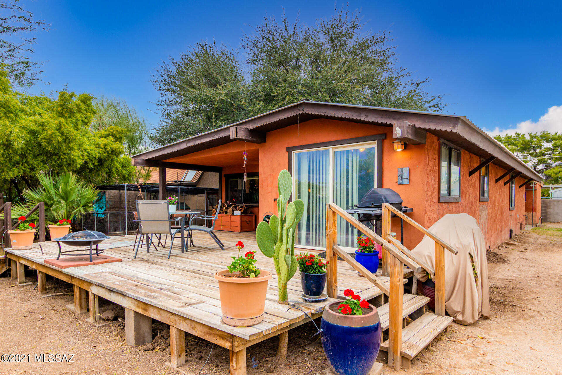 Spectacular single family 3 bedrooms, 2 bath with huge workshop! Enter into the welcoming home with an open floor plan. The great room has a large wood-burning fireplace perfect for roasting s'mores in the winter. The kitchen is equipped with SS appliances, custom crafted cabinets, desk space, and island breakfast bar. Step outside to the oversized yard that has an enclosed garden , fruit trees, room for parking cars, and wood fencing for privacy. The raised extended deck and patio space is great for BBQ cookouts. Towards the back of the property is a huge 523 SF workshop with access from the alley. Work shop permits have not been finalized. Septic maintenance and new leach field with warranty. NEW HVAC! Make this one of a kind home yours today