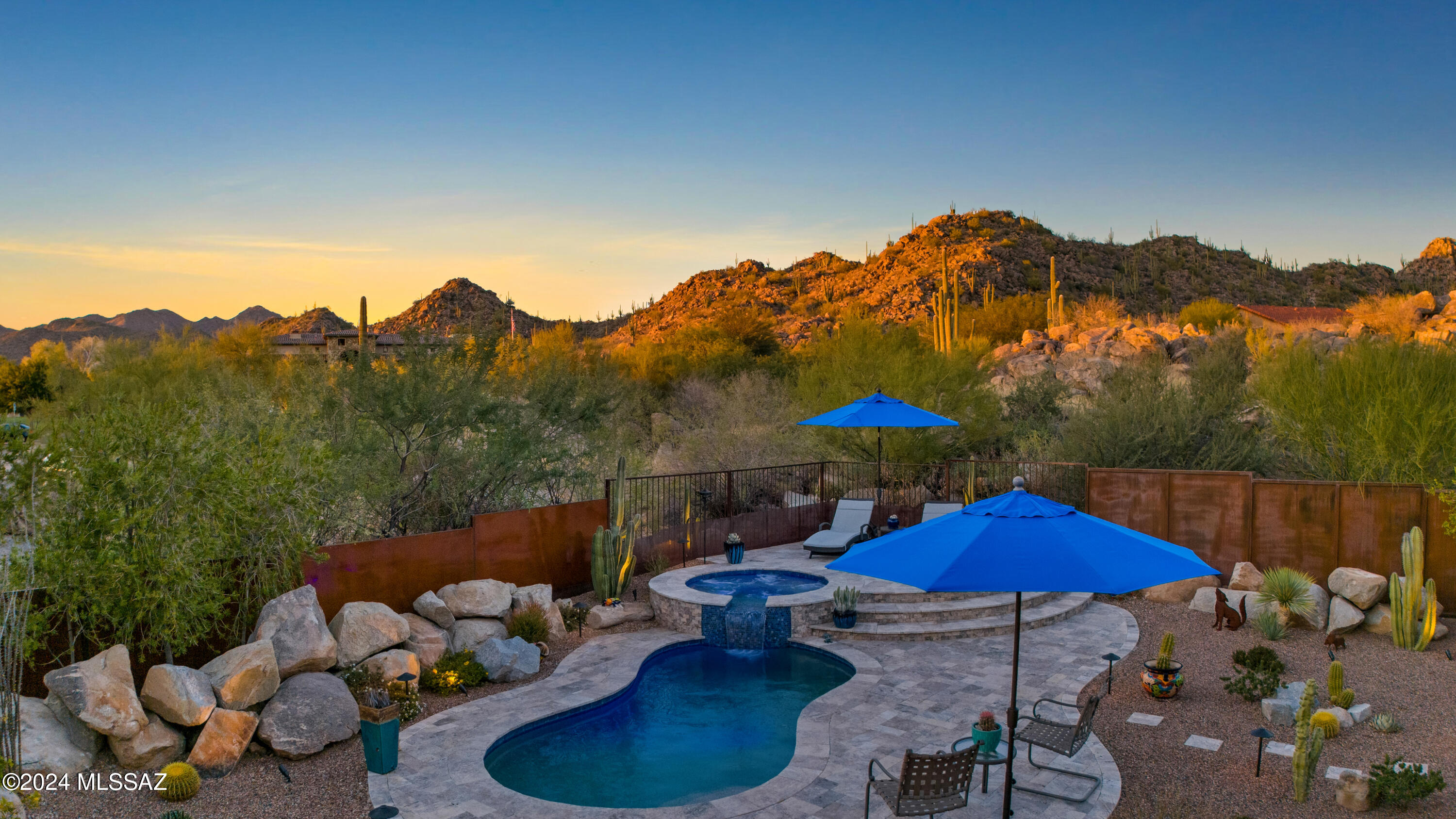Golf Casita with Pool and Spa, on one of the largest parcels in the community. 
Experience luxury living in this modern-style casita, perfectly situated just steps from the clubhouse and driving range. 
Step inside and be greeted by vaulted ceilings with exposed wood beams, elegant porcelain flooring, and a spacious great room featuring a gas fireplace and a stone feature wall. The open-concept kitchen is a culinary dream, showcasing a large island with gorgeous countertops with bar seating, stylish pendant lighting, sleek white cabinetry, stainless steel appliances, along with a wine & beverage fridge at the dry bar. The breakfast bar further enhances the space, making it perfect for casual dining and entertaining.
(click more)