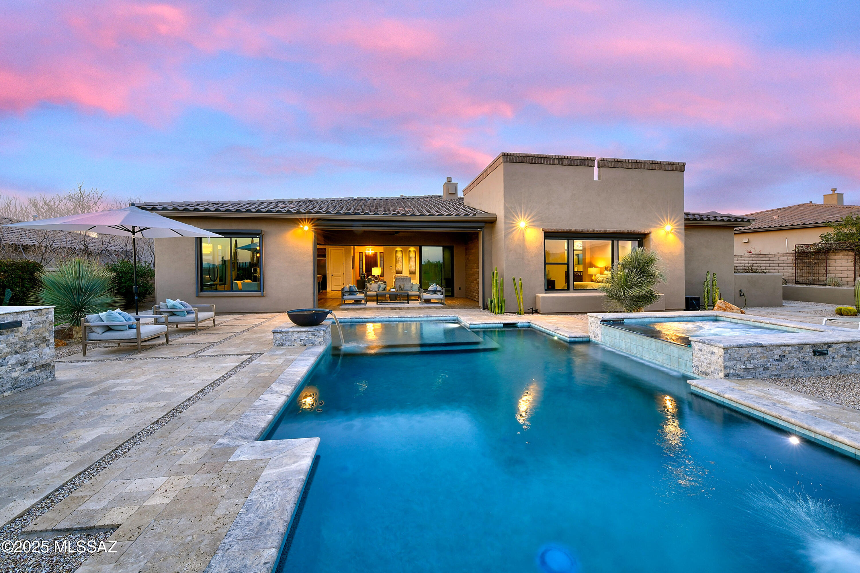 * DESERT DELIGHT* FABULOUS SW CONTEMP ON ONE OF THE BEST LOTS IN LOS SAGUAROS! TOLL BROS ESTATE HM- BORDERS GALLERY SOUTH COURSE- NEW HOME OF LIV TOURNAMENT! BREATHTAKING VIEWS OF SEVERAL MTN RANGES... INCLUDING CATALINA ''PUSCH RIDGE'' EAST FACING BCKYD- .30 ACRE FILLED W/AMAZING RESORT STYLE POOL/SPA, WATER SPILLS, FIREBOWLS, OUTDOOR KIT/BBQ, TRAVERTINE PAVERS & MATURE LANDSCAPING MAKES THIS YARD A OUTDOOR PARADISE!!  EXQUISITE DESIGN & DECORATED W/ELEGANCE! VANISHING DOORS CREATE INDOOR/OUTDOOR LIVING, MODERN GAS FP, UPGRADED CABINENTRY/SLAB QUARTZ CTRS/KIT AID PROFESSIONAL SERIES APPLIC, TONS OF ACCENT LIGHTING, OVERSIZED PLANK TILE, ENSUITE- GUEST RM, PRIMARY- SPA LOOK/SOAKING TUB, 3RD CAR- GYM, FLEX RMS- DINING + DEN... IMMACULATE CONDITION! ATTACHED LIST OF UPGRADES