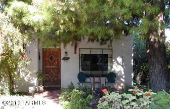 Fabulous 3BR, 2BA home privately situated in the Sam Hughes neighborhood. Additional detached 3-rm building adds 800 s.f. and 1/2 bath. Comfortable living spaces wrapped by walled yard for plenty of safe space for children and outdoor enjoyment, incl. outdoor fireplace, covered patios, decorative pond & shady, mature vegetation.
Minutes from UA campus, 2 miles from downtown Tucson.  Tasteful improvements include low-e, double-paned windows and solar-tube skylight. Walk or bike to restaurants, Rincon Market, Himmel Park, public library.
Outbuilding is the ultimate flex space.  It would be a dream yoga studio, art studio, giant office, audio/video production studio, band rehearsal space, also perfect as recreation room, workshop,or guest space. Studio has 1/2 bath and is insanely soundproo Musician's Dream sound studio was constructed in in 2004 for professional audio recording & production. It is a fully sound-insulated, (double-wythe CMU, fully grouted with air-pocket between) Large, well-lit space with separate control room, vocal-isolation booth, and 1/2 bathroom. Drum-riser included. Large open space with concrete floor makes it the perfect versatile flex space.