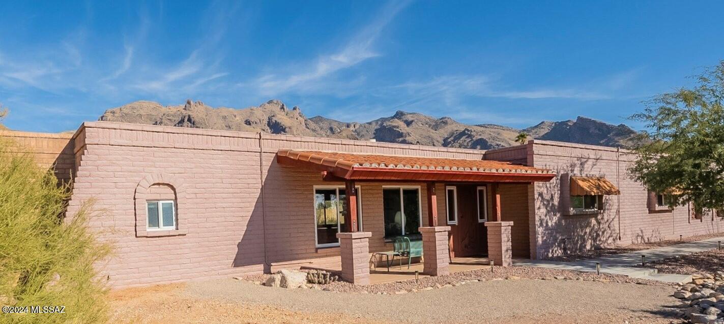 This home is nestled in a natural desert setting on a .86 acre lot, offers outstanding views of the Catalina Mountains and sensational city views. The Location is perfect for foothills living with quick access to La Encantada with its fabulous stores and popular restaurants, and close to popular hiking and biking trails. This move-in ready home offers a split bedroom plan, open concept great room, high and finishes, a cozy masonry fireplace, Pella Impervia windows, custom cabinets, stainless steel appliances and plenty of storage. The quality block construction, newer roof and HVAC enhances the value of this home. Homes in this area are highly sought after and not often available at this fantastic price. It's a rare opportunity. Shown by Appointment Only.