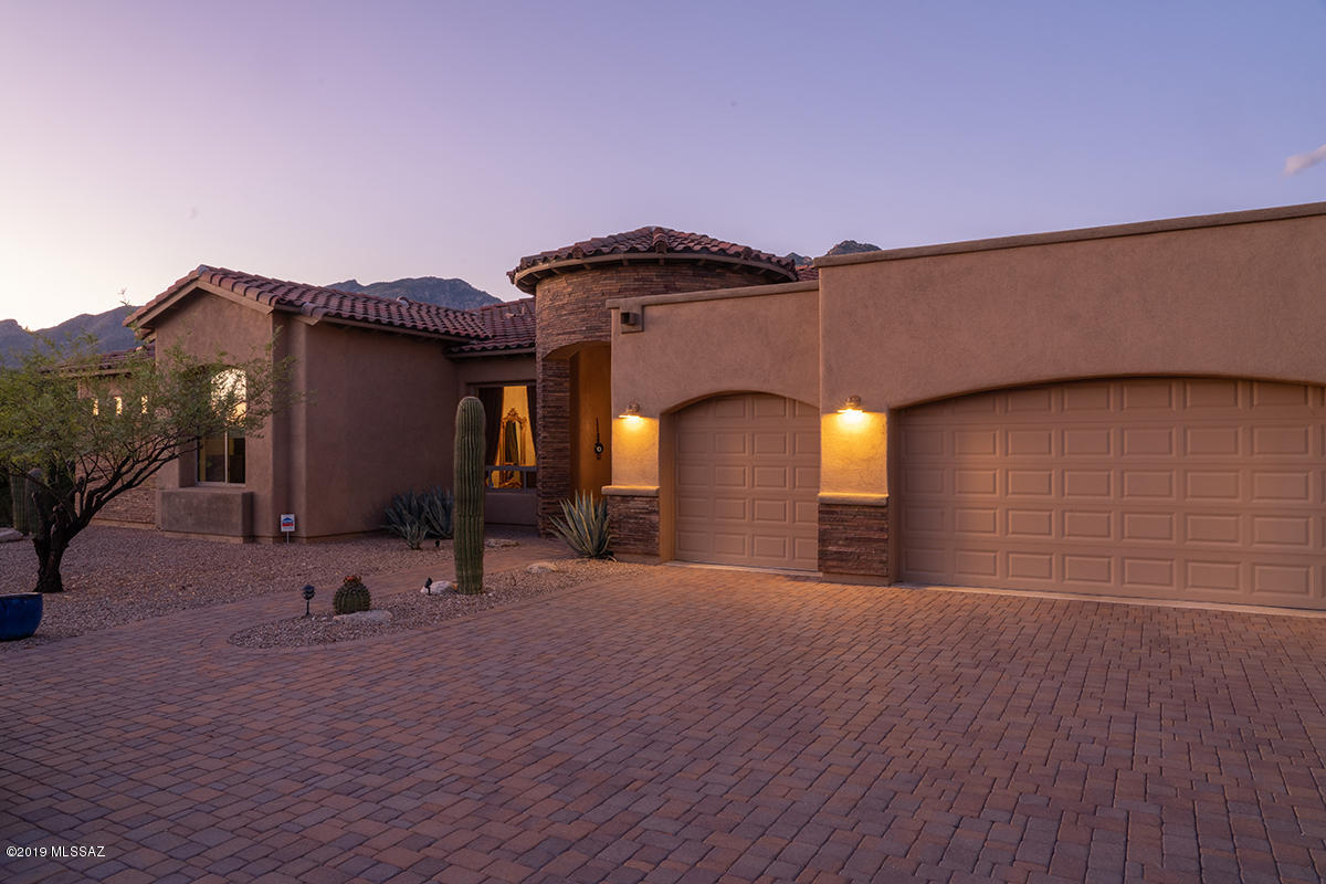 Price Improvement .. Well below comparable properties in the same neighborhood.
Priced to sell!!   
Nestled behind the gates of the tranquil Ventana Reserve II is this gem reaching out and hugging the spectacular majestic Catalina mountains. The smooth flow of the floor-plan adds to its charm, practically and beauty. Sparkling chandeliers adorn the ceilings.  Kitchen boasts a spacious island, breakfast bar, granite-counters, stainless steel appliances, Lazy Susan. Central vac. Floor covering; Ceramic tiles throughout , 2 carpeted bedrooms, hardwood floor at the main dining room. Separate living and dining rooms elegantly draped with exquisite silk curtains marrying the traditional with the contemporary. Extra large walking closets, seating areas throughout the master suite. Second master bedroom conveniently accommodates house guests.
Take morning and evening walks to the popular  Sabino Canyon National Park or tee off at the nationally renowned Ventana golf course.
Close to great shopping centers and restaurants. Foothills living at its best!