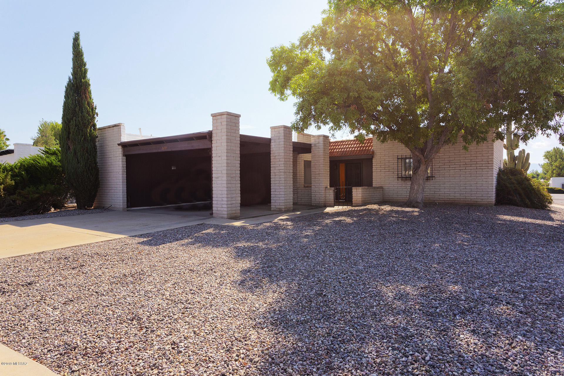 MAJOR UTILITY UPGRADES!  Please see the sellers disclosures.  Now all that is needed is to add your own interior touches and enjoy the beautiful view.  This 1974 original owner home features 2 bedrooms, 2 bathrooms, a 2-car carport, and a dual-pane window-filled east-facing solarium with fireplace that frames the classic Santa Rita mountain view.  The corner lot is one block from the GVR Abrego South Pool and Recreation Center.  The Bryant HVAC was installed in 2008 as was the water heater.  Desert Meadows 2  Homeowners Association dues are currently $20/year.

Recent upgrades include new gas and electric service as well as new Square D electric panel.  Licensed Roof re-coat and 3-year warranty. Sewer scope in November, 2019 was clear.  Five original single-pane windows remain..