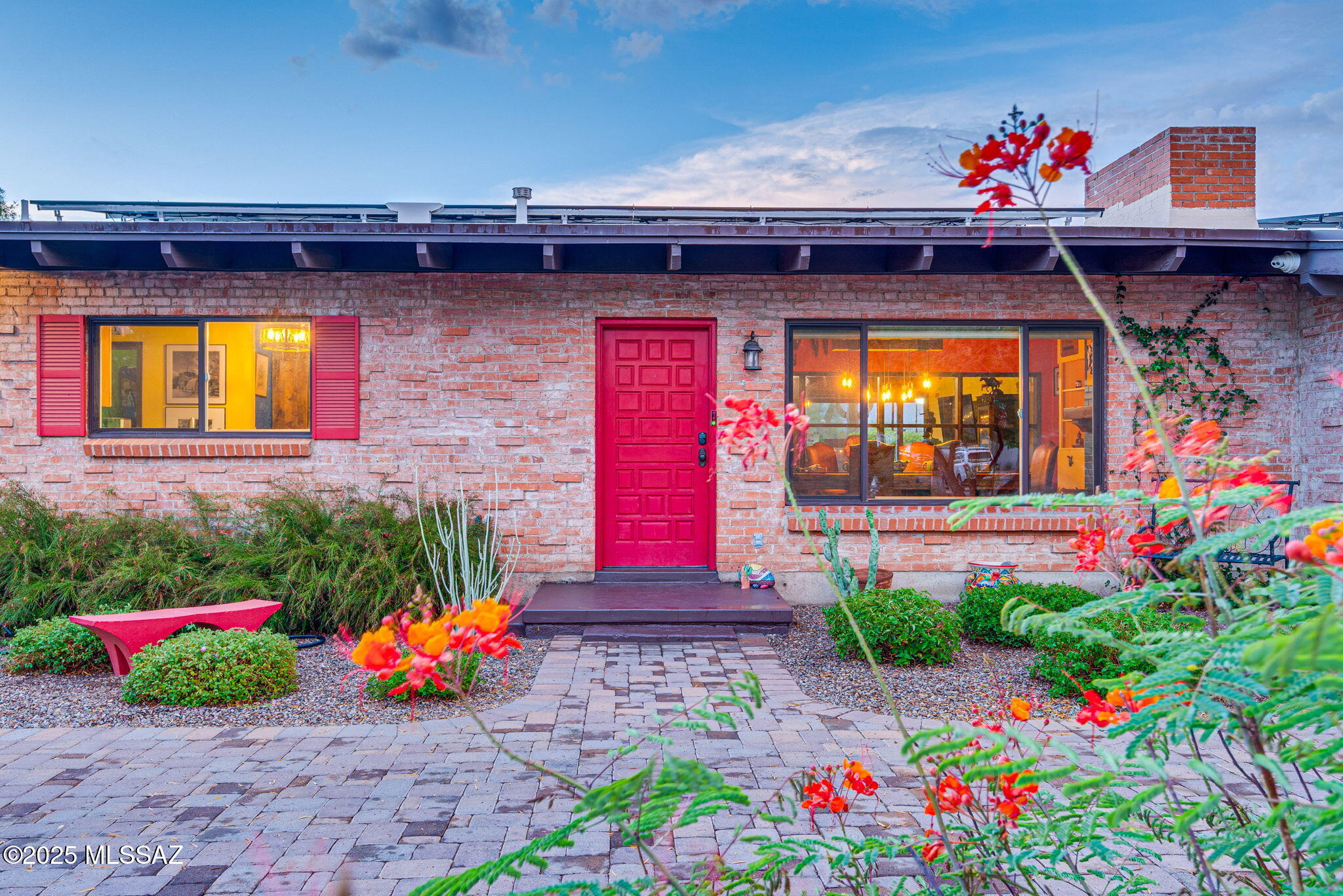 Historic Blenman-Elm, but make it mid-century cool meets colorful Tucson soul! Live like a local, where Tucson's history and convenience collide. This 1958 double brick mid-century stunner offers the ultimate in LOCATION, LOCATION, LOCATION! Situated on a .28 acre corner lot with mountain views, sparkling pool, 1 Bedroom/1 Bath guest house and new solar system, near all things Tucson. The exterior winks MCM while the interior pops with vibrant Mexican color: joyful, warm and absolutely unforgettable. Inside, the open, vaulted, exposed wood beam ceilings showcase how the Great Room flows seamlessly to the exceptional indoor/outdoor entertainment spaces with Catalina Mountain views on display from the Dining and Living areas, as well as the Primary En Suite and Bedroom 3. . *CONT-- Split 3BR/2BA floor plan in main house offers privacy and function. Casita flexes beautifully as space for guests, an office, studio or high income-producing ADU!

Curb appeal ... Ooooo La La! Pull up to circular drive with pavers, gorgeous drought resistant irrigated landscaping, driveway to gated carport and a welcoming red door entrance. 

The backyard not only reflects a private sanctuary. Here you will also find two majestic saguaros and at least 10 fruit (bearing) trees! The extensive covered patio offers reprieve from the sun and entertainment and dining spaces. 

Current homeowners invested $85,000 in thoughtful, smart, stylish and energy-wise updates.

Just minutes to UofA, Downtown, Banner Hospital, culinary gems, coffee culture, bike paths, and everything that makes Central Tucson irresistible. 

LOCATION. STYLE. SMART UPDATES. 

This is a rare one: Mid-century build, modern systems, colorful soul and the entertainment backyard that you've been manifesting. Come see why Blenman-Elm loyalists never want to leave!