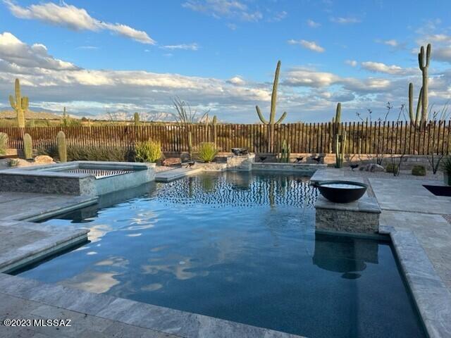 * DESERT DELIGHT* FABULOUS SW CONTEMP ON ONE OF THE BEST LOTS IN LOS SAGUAROS! TOLL BROS ESTATE HM- BORDERS GALLERY SOUTH COURSE- NEW HOME OF LIV TOURNAMENT! BREATHTAKING VIEWS OF SEVERAL MTN RANGES... INCLUDING CATALINA ''PUSCH RIDGE'' EAST FACING BCKYD- .30 ACRE FILLED W/AMAZING RESORT STYLE POOL/SPA, WATER SPILLS, FIREBOWLS, OUTDOOR KIT/BBQ, TRAVERTINE PAVERS & MATURE LANDSCAPING MAKES THIS YARD A OUTDOOR PARADISE!! ORGINIAL OWNER- EXQUISITE DESIGN & DECORATED W/ELEGANCE! VANISHING DOORS CREATE INDOOR/OUTDOOR LIVING, MODERN GAS FP, UPGRADED CABINENTRY/SLAB QUARTZ CTRS/KIT AID PROFESSIONAL SERIES APPLIC, TONS OF ACCENT LIGHTING, OVERSIZED PLANK TILE, ENSUITE- GUEST RM, PRIMARY- SPA LOOK/SOAKING TUB, 3RD CAR- GYM, FLEX RMS- DINING + DEN... IMMACULATE CONDITION! ATTACHED LIST OF UPGRADES