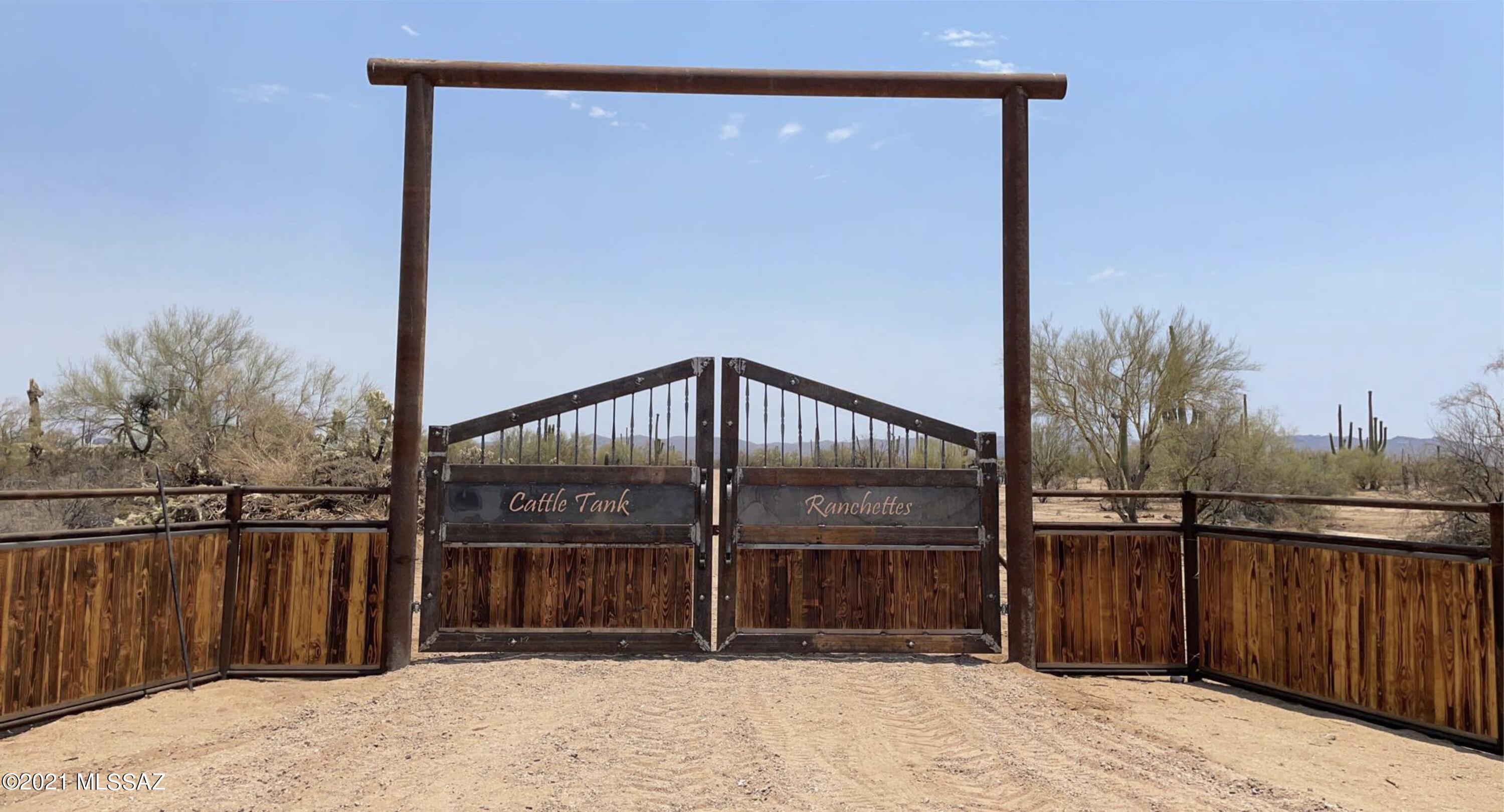 Enter through a Grand Custom Metal Gate Entrance onto this beautiful 2.27 acre parcel. Right off of the pavement! Private driveway with gated access. This lot is ready for your dream home! Shared well, Power to lot line. Natural desert landscape and remarkable views. Quiet and serene yet just minutes from shopping and restaurants. Escape the city with this private desirable location. Deed restricted to site built homes.