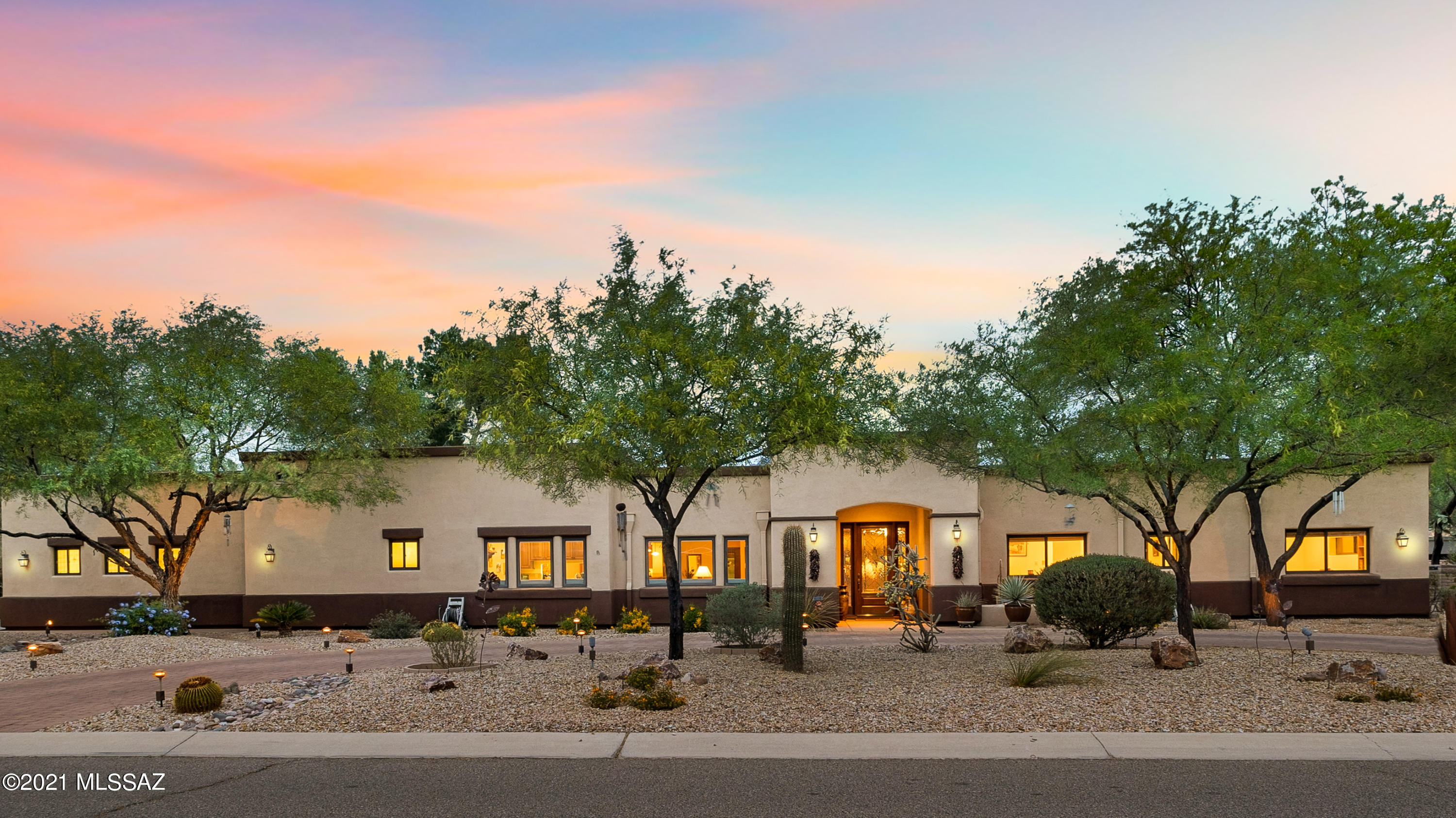 For those searching for an incredible luxury home, look no further than 6113 E. San Leandro Drive. This property is found in the heart of Tucson Country Club Estates. A private gated community which features a Championship 18-hole William Bell designed golf course, tennis/pickleball courts, aquatic & fitness centers, dining & event space. This elegant home features winding pathways, 4 bedrooms, 3.5 bath main house, 546 sq-ft office/studio/recreation room, 448 sq-ft detached pool house with bath, and a heated/cooled workshop. It is clear from the moment you walk through the front door that every detail was thoughtfully considered. This home exemplifies classic architecture and will appeal to a buyer with an affection for quality & taste. The beautiful gourmet kitchen has granite counter-tops, a generous center island, Merillat kitchen cabinets, gas cook-top, double ovens & wet bar. The master suite is complete with a custom walk-in closet, soaking tub, walk-in shower and heated floors.
This entertainer's dream house boasts a spacious backyard with mature landscaping and intercom and stereo system. An extended patio with solar heated pool, hot tub, shaded outdoor kitchen, built-in barbecue with seating at the bar or multiple seating area for al fresco dining, perfect for Tucson sunsets. Enjoy fresh fruit and vegetables from the established raised garden. This property is a private paradise in the heart of the city.