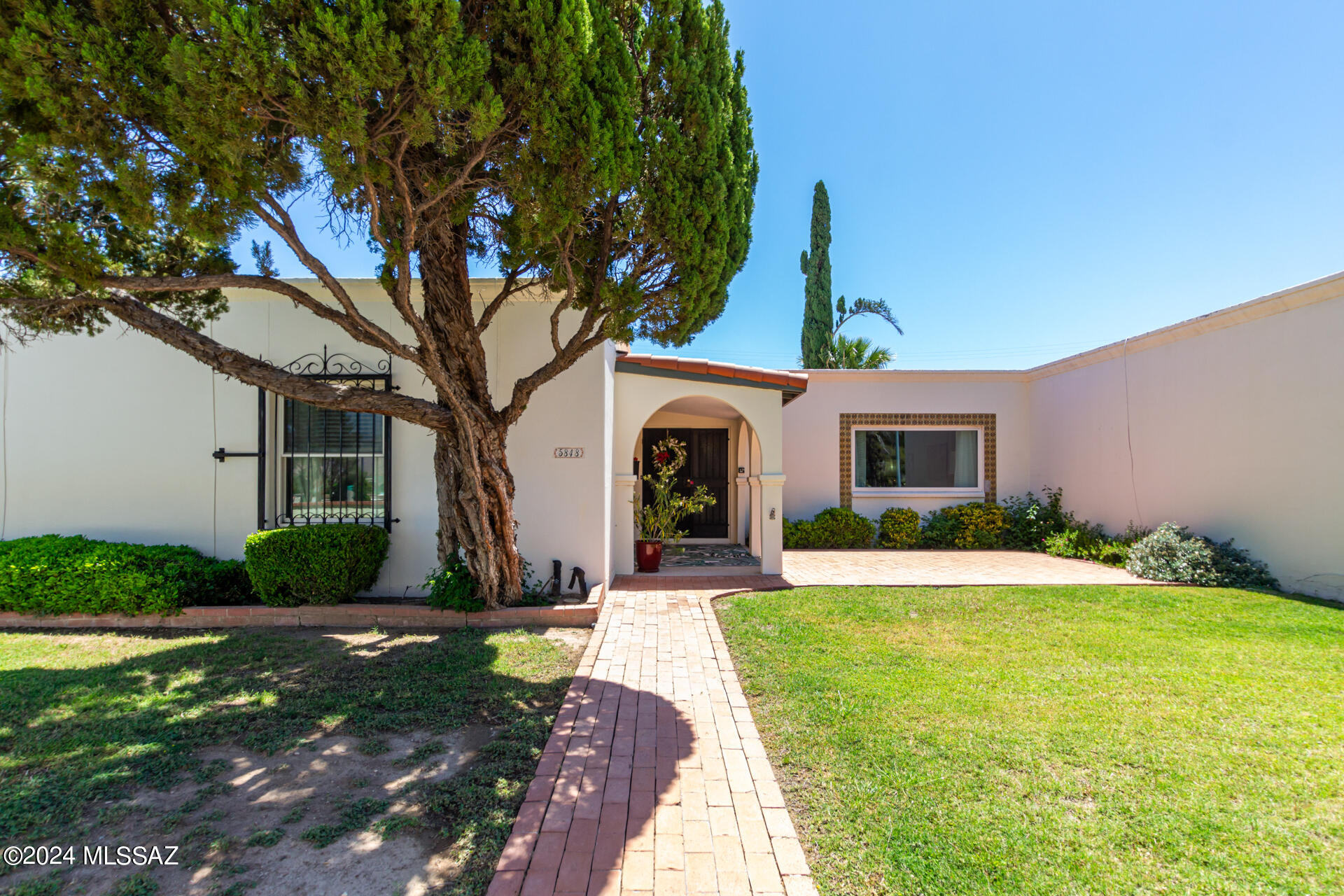 Fall in love with this charming 2-bedroom 2-Bath unit in La Granada Townhomes. 55+ community. Beautifully remodeled. Resort like backyard is an oasis providing quiet, privacy, and outdoor living at its best. Spanish hacienda ambiance. Huge DETACHED 2 car garage! Welcoming lush front yard. Open interior with wood-look floors, skylights, neutral palette, and a large living room. Ideal for entertaining. Gourmet's kitchen and a formal dining area. Functional kitchen w/ tile backsplash, ample cabinets, luxury granite counters, and SS appliances convey. Main bedroom features bi-fold door closets and a private bathroom with shower & tub combo. This is a one of a kind property. Please schedule your viewing today. Don't miss out.