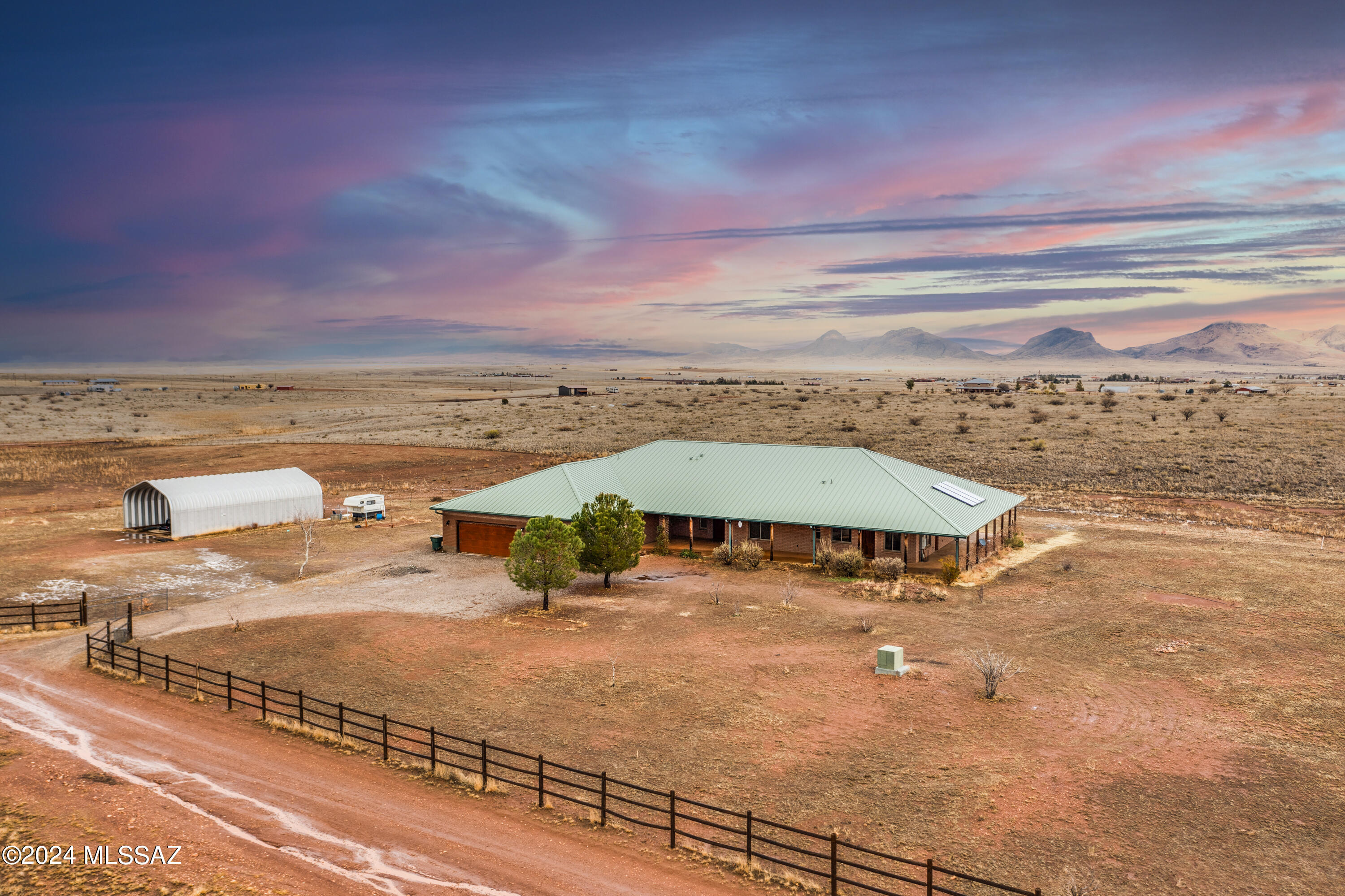 Located off winery row, this 3,194 sqft home has panoramic views of Arizona's wine county . The views expand and over 5 different mountain ranges that can enjoyed  from the beautiful covered wrap around patio. The 6 car garage offers ample space for any car enthusiast. 
The Quonset hut can be used as horse stalls or additional storage. 
This home is a must see!!