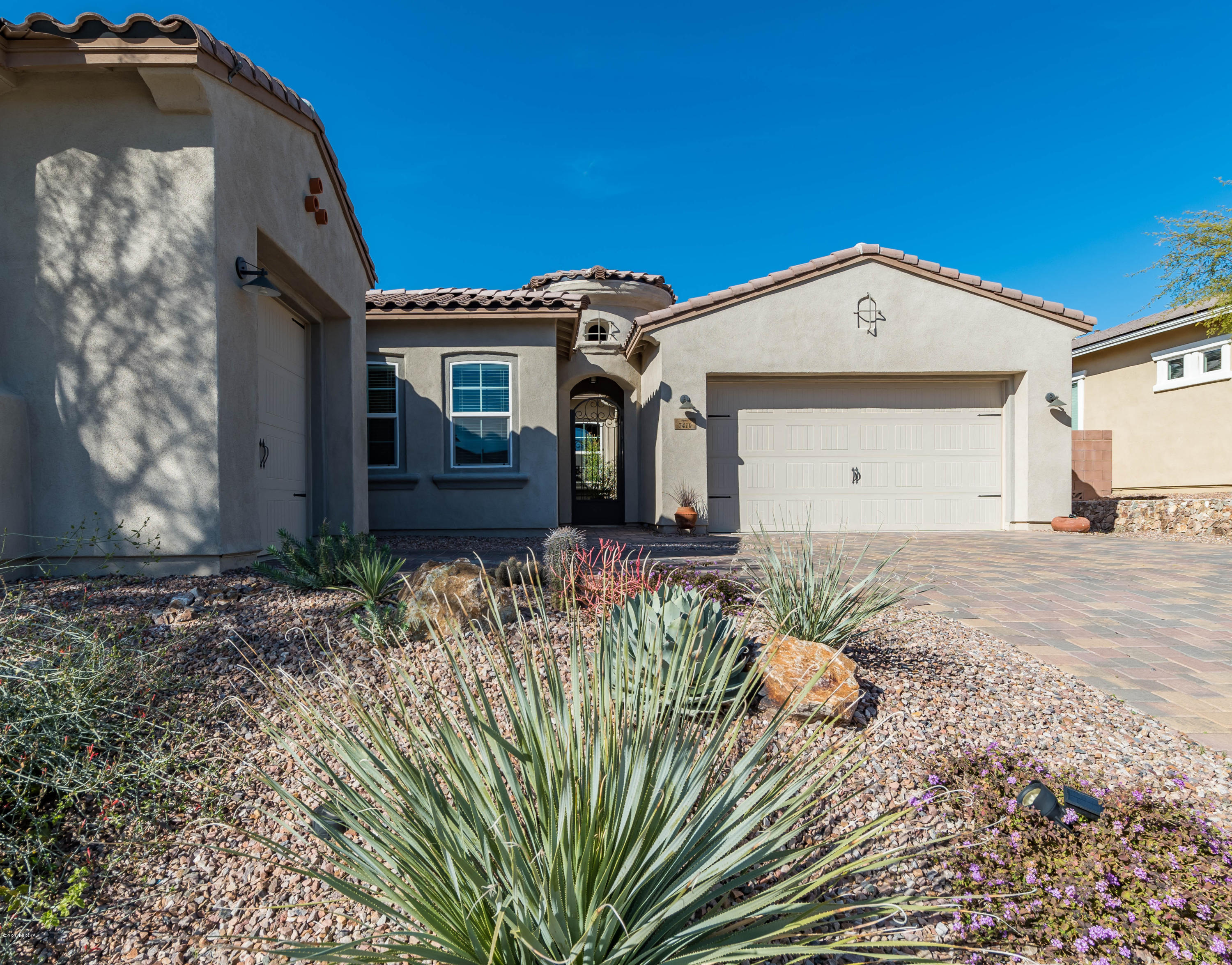 Gorgeous Cimarron Model features charming interior pavered portico & courtyard. Bright & airy foyer leads to huge open great room. Stacked sliding glass door offers breathtaking mountain & saguaro views. Gourmet kitchen is a dream with tiled backsplash, 5 burner gas cooktop, double oven, walk-in pantry, wine fridge, & granite counters. Private master suite w/coffered ceilings, beautiful mountain views from picture window, & large walk-in closet. Pamper yourself in this beautiful master bath w/walk-in shower,dual sinks. & garden tub. Large laundry rm w/ great counter space & full storage cabinets. Tandem 3 car garage & separate 4th car garage, plus a fire suppression sprinkler system. Backyard is complete w/covered patio, professionally landscaped, plus a fireplace. Close to hiking trails.