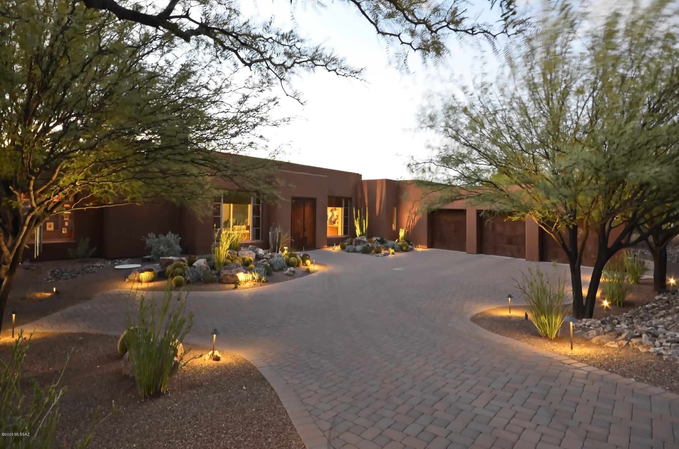 Beautifully maintained custom Gem in gated Oro Valley community. So much attention to detail in every finish. Gourmet kitchen features huge granite island and sinks, ample work space, high end appliances and is open to the family room and adjacent breakfast room. Dramatic formal living room with cozy sitting area, FP and separate formal dining. Amazing master suite with a traditionally designed office/ library, FP and luxurious master bath with room-sized open closet, Split plan with guest bedrooms each with attached bath. Spa and bar-be-que is off the kitchen area. Large pantry, nice laundry room and over-sized 3 car garage epoxy flooring with storage. This home is so well thought out, would be easy to lock and leave. or add a pool. But will amaze with the pride of ownership!!