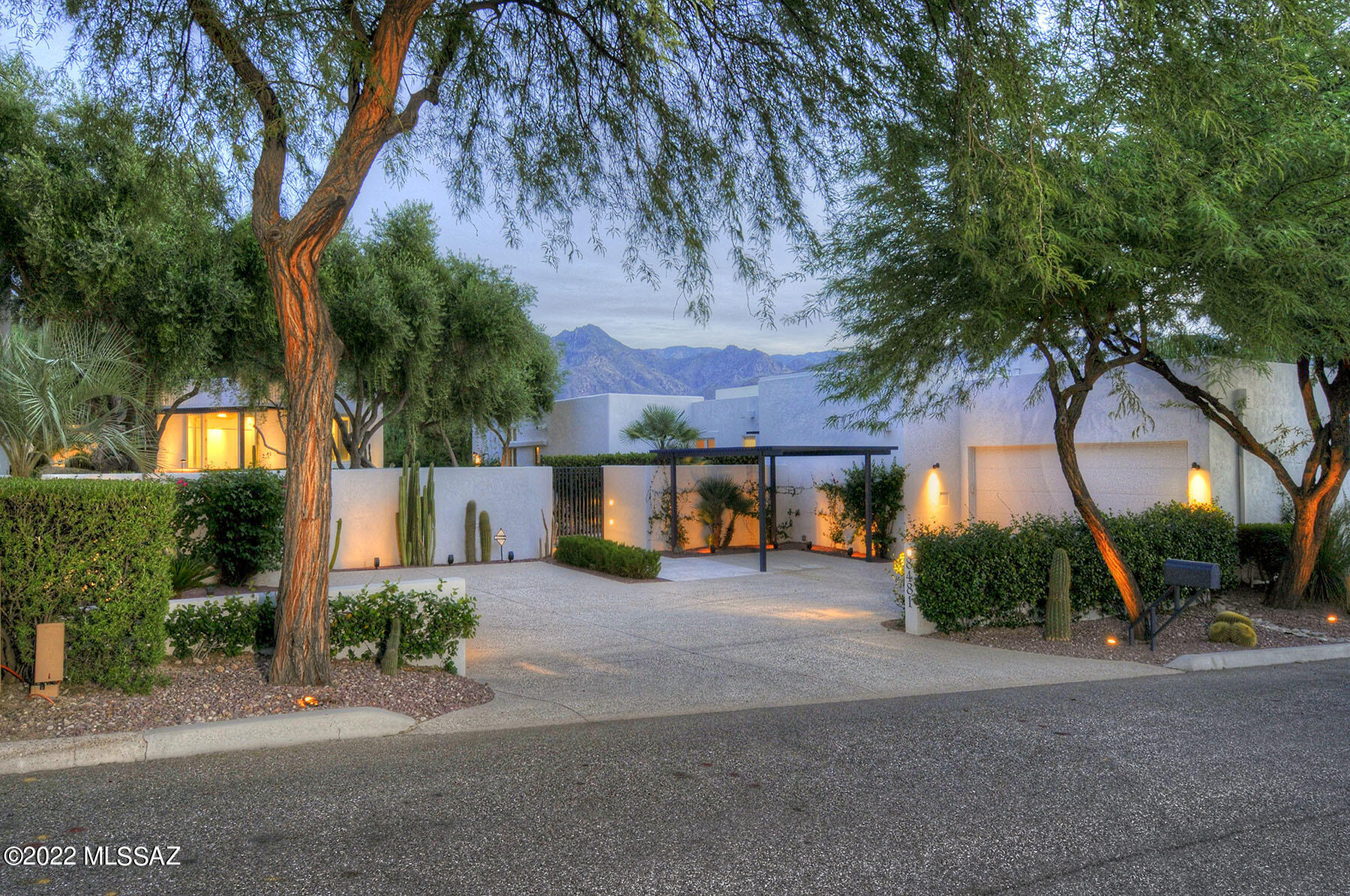 Tucked within the serene, gated grounds of prestigious Canyon Ranch Resort, this stunning contemporary home, designed by acclaimed New York architect Bromley Calderi, is a celebration of light, space, and sophisticated desert living.
Inspired by modern art and architecture, the residence features soaring ceilings, gallery-style walls perfect for displaying artwork, and expansive windows framing breathtaking views of the Catalina and Rincon Mountains. At the heart of the home is a dramatic great room with a fireplace, open-concept kitchen, and light & bright breakfast area, ideal for entertaining or enjoying quiet mornings.
The primary suite is a private retreat with a spacious sitting area, dedicated office/exercise area, European-style closets, a walk-in closet, and a luxurious spa like bathroom with a jetted soaking tub. Every detail of this home has been thoughtfully curated for comfort, elegance, and tranquility.
Surrounded by mature landscaping, multiple patios, and featuring a sparkling pool, the outdoor spaces are perfect for enjoying Tucson's year-round sunshine. Located just steps from the renowned wellness amenities of Canyon Ranch, this home offers the ultimate blend of privacy, luxury, and lifestyle.