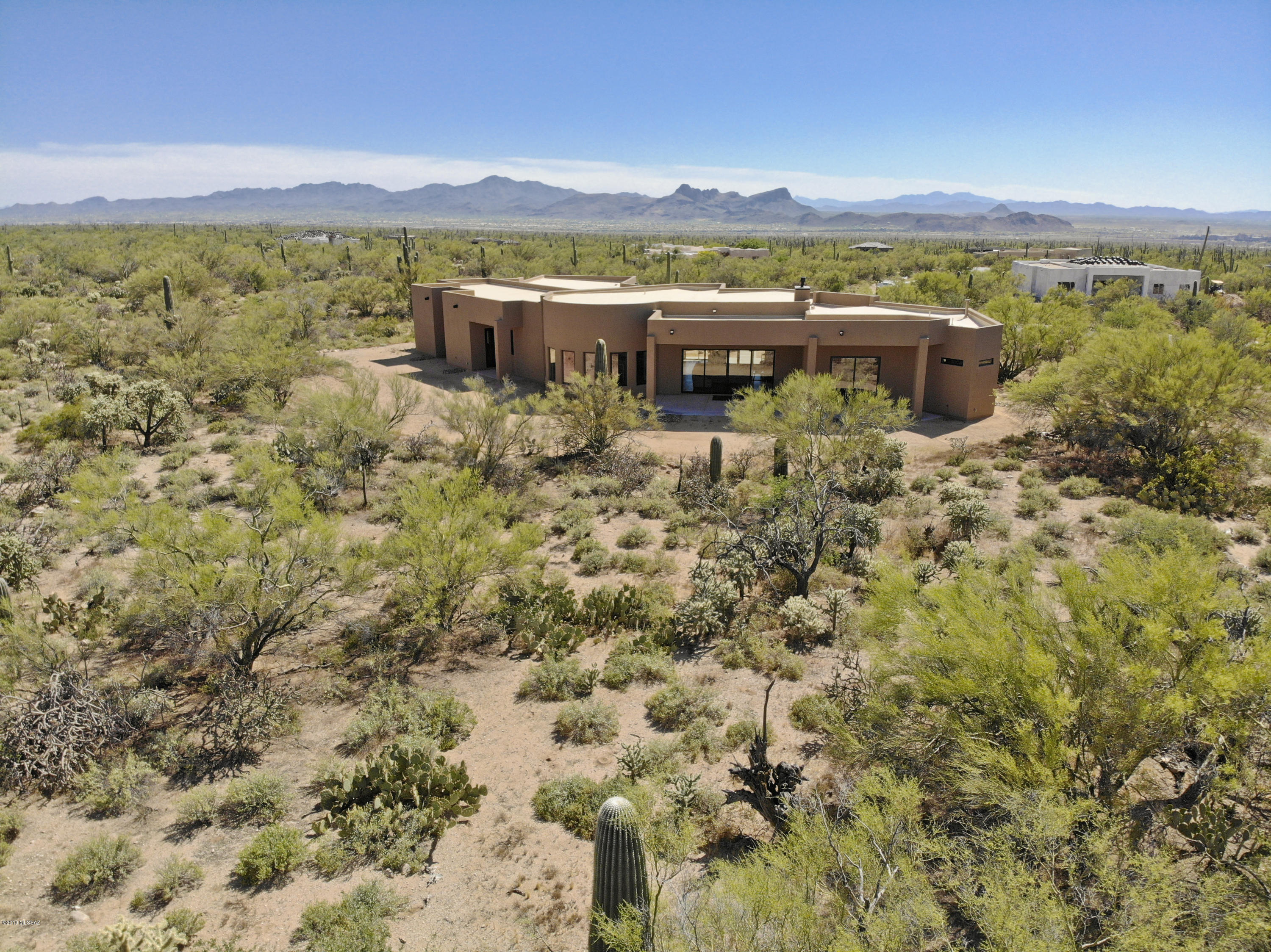 PRIVACY, QUALITY, VIEWS & VALUE! Enjoy a very private 2.57 acre lot & appreciate excellent Tortolita Mountain views from the backyard while stunning sunset vistas of the Tucson Mountains await from the entry, den & dining. Those interested in quality construction will appreciate this 3,750 square foot,open layout design from premier local builder John Herder. Located within the gated community of The Estates at Tortolita Preserve this sensational home is now completed! Features includes an oversized 4-car garage,split bedroom layout with 4 bedrooms,a separate office/den,a formal dining room,and a large kitchen with nook,breakfast bar,and center island. Integral colored concrete floors & many other premium finishes! John Herder Building delivers SUPERIOR QUALITY & CRAFTSMANSHIP.View 3D Tour