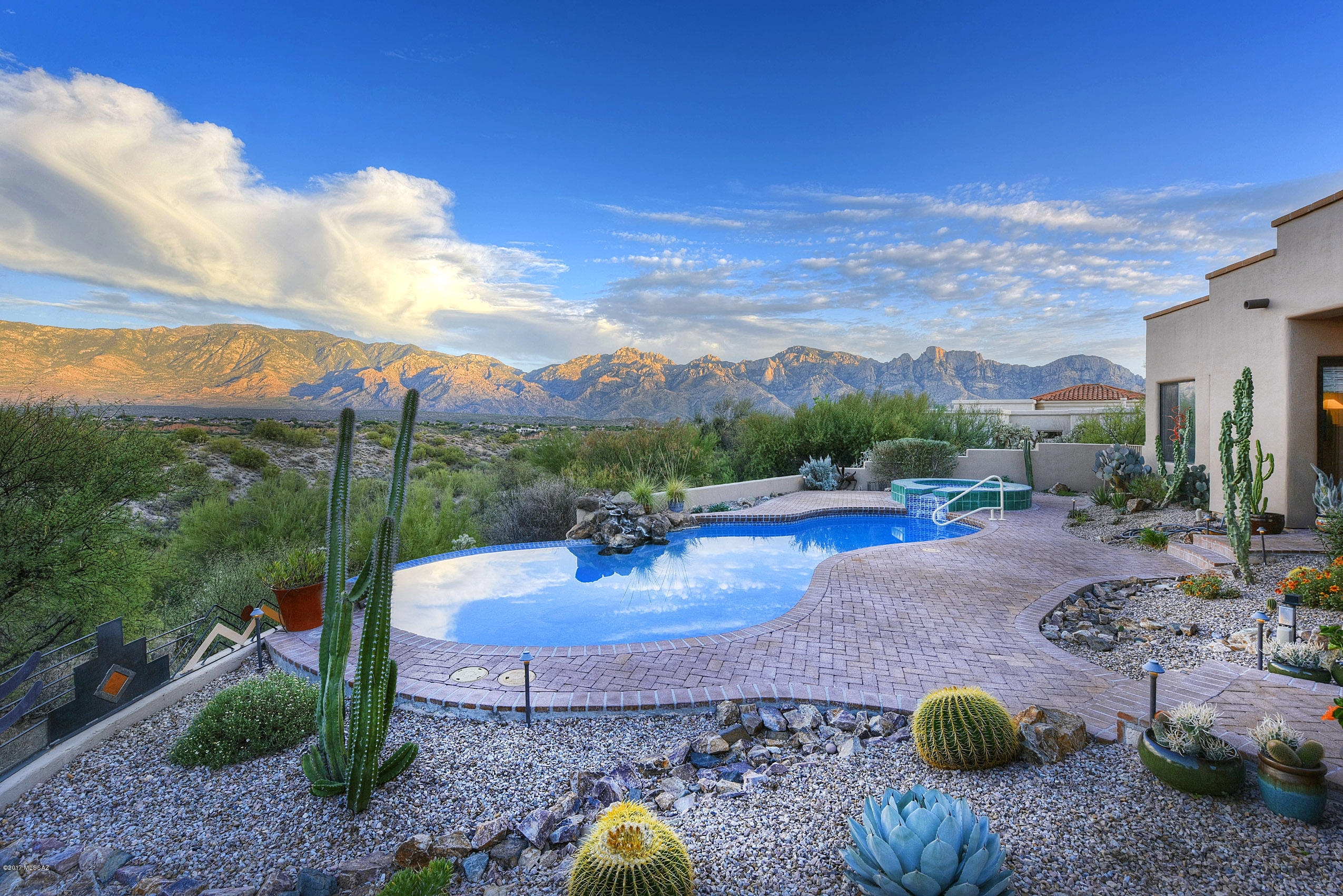 One of the most lovely settings in all of Oro Valley.  The home is located in High Mesa, a small gated community in Rancho Vistoso.  Enjoy the privacy of living on almost an acre, with backyard facing northeast, capturing vast, unobstructed views of the Catalina Mountains. Interior is a tasteful contemporary with soft southwest touches.  Split floor plan with three bedrooms as well as large office/den with custom built cabinetry.  Slate floors, granite finishes, exquisite opulent lighting throughout.  The Backyard is ideal for entertaining and lounging in pool/spa, overlooking coveted preserve and glorious mountain ranges.  Many fine interior and exterior features.   Pool and Spa were upgraded with solar heating system.    A home worth waiting for!