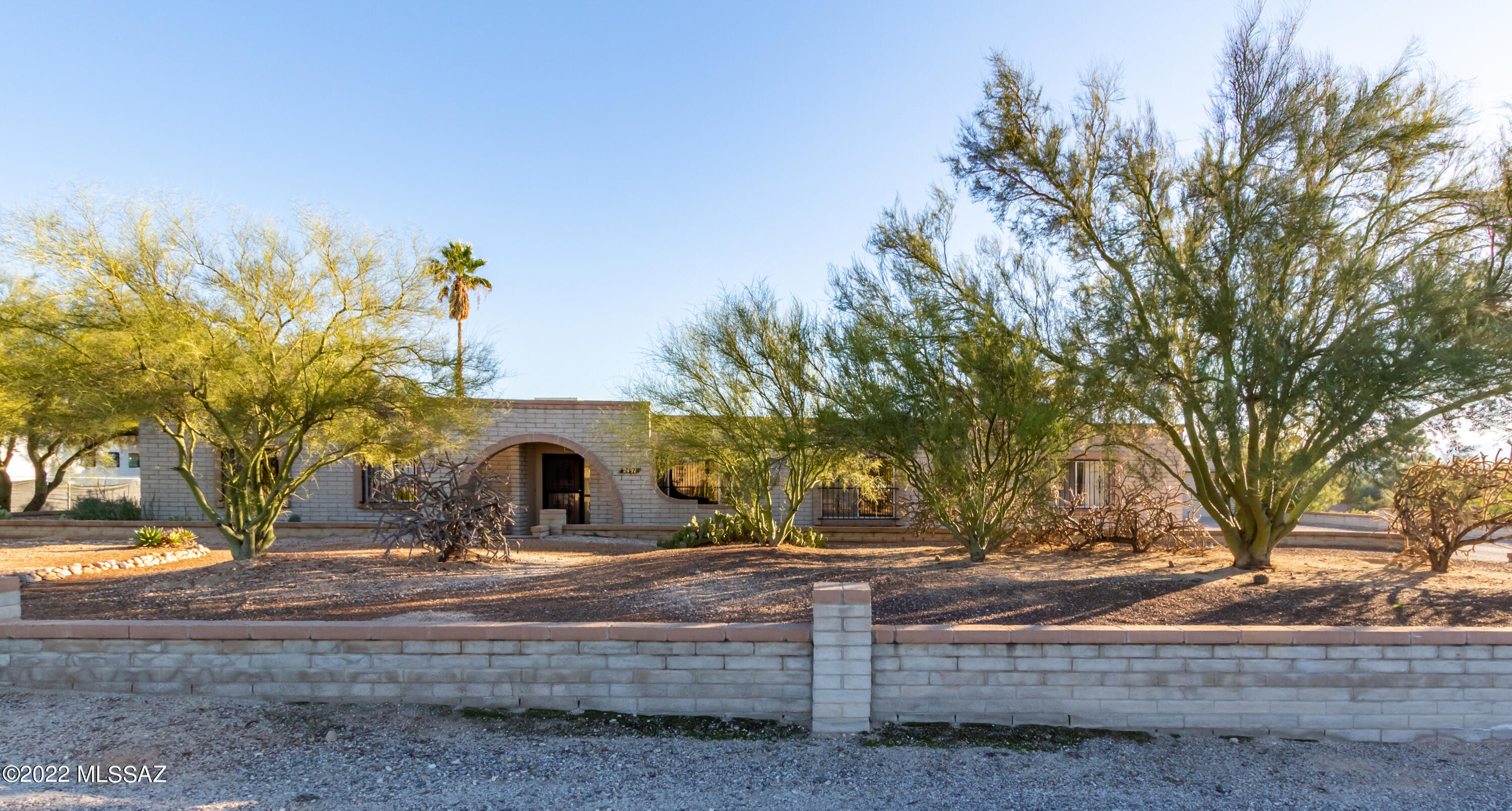 Charming, beautifully maintained block construction home situated on a private .87 acre corner lot. Located in the desirable Casas Adobes West neighborhood, enjoy your own private backyard oasis! Immaculate backyard retreat is complete with professional landscaping, glistening pool, lush desert vegetation, covered patio, and incredible sunset views. This home features a fantastic 5 car garage currently being used as a game room with spacious workshop/hobby room. The inviting interior boasts an oversized family room with cozy fireplace and patio access, spacious dining/living room with expansive windows overlooking the beautiful Catalina mountains, and a tastefully upgraded kitchen. Kitchen features a pleasant breakfast bar with gorgeous recessed lighting, freshly painted cabinets, granite countertops, and upgraded SS oven and microwave. Master bath offers unique shower tiling, granite countertops, and modern sink/faucet. Ideally located near abundant shopping and fine dining. Welcome home to your private desert oasis!