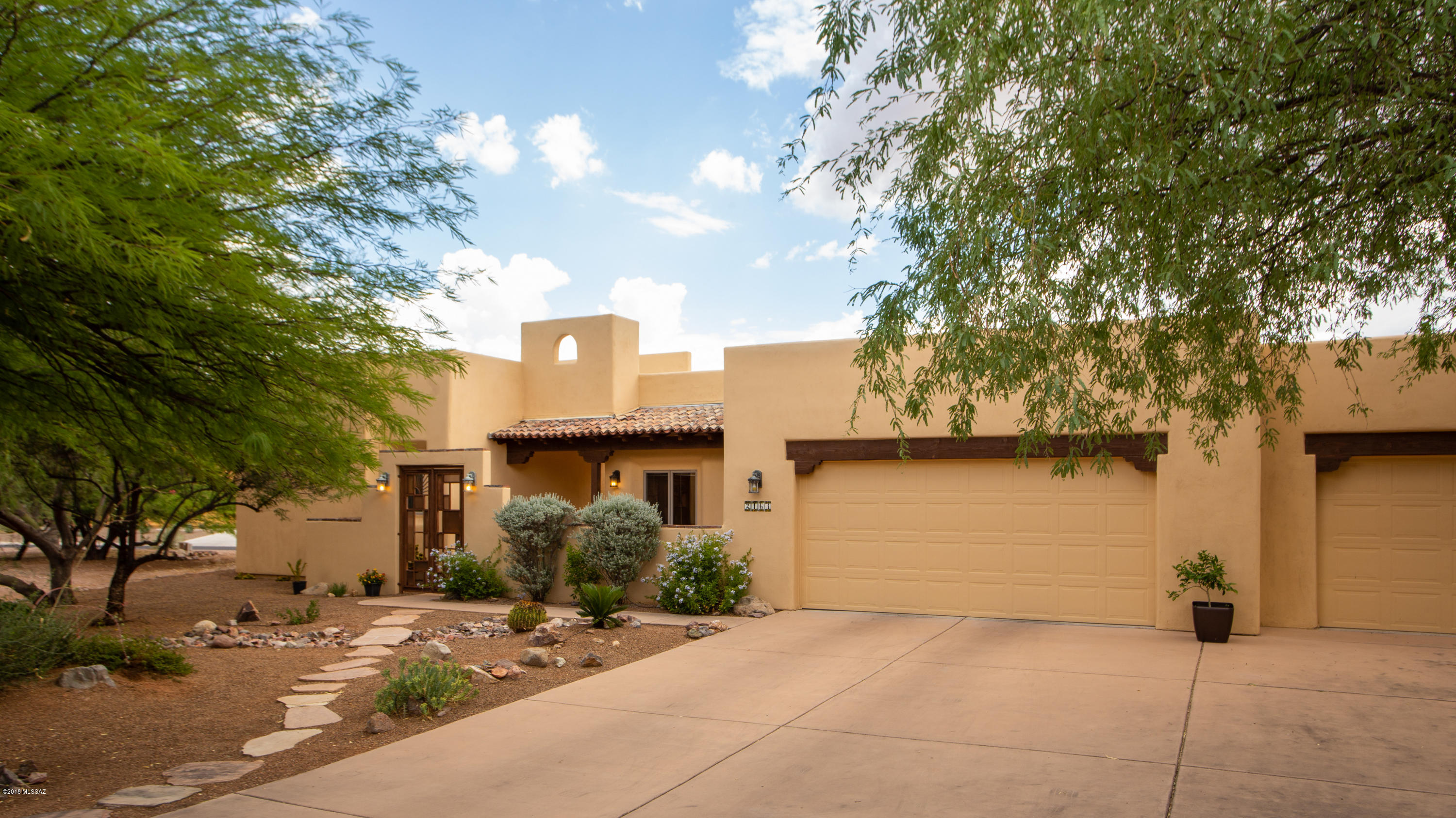 This wonderful Santiago home is the perfect full time or part time ,lock and leave, Tubac residence. The large .45 acre lot gives you the room and privacy you want coupled with low maintenance living. The 341 sq foot separate casita with full bath is spacious and provides a private residence for visiting family or friends or a great office or studio for you. An interior courtyard nestled between the main house and the casita has an outdoor fireplace,walled privacy, and a covered patio. The main house has a master suite,large living room with fireplace,den,and a beautiful kitchen with a great island and lots of fine cabinetry. The extended three car garage gives you plenty of room for your toys,storage, and a work area. This home is in beautiful shape and tastefully finished.
