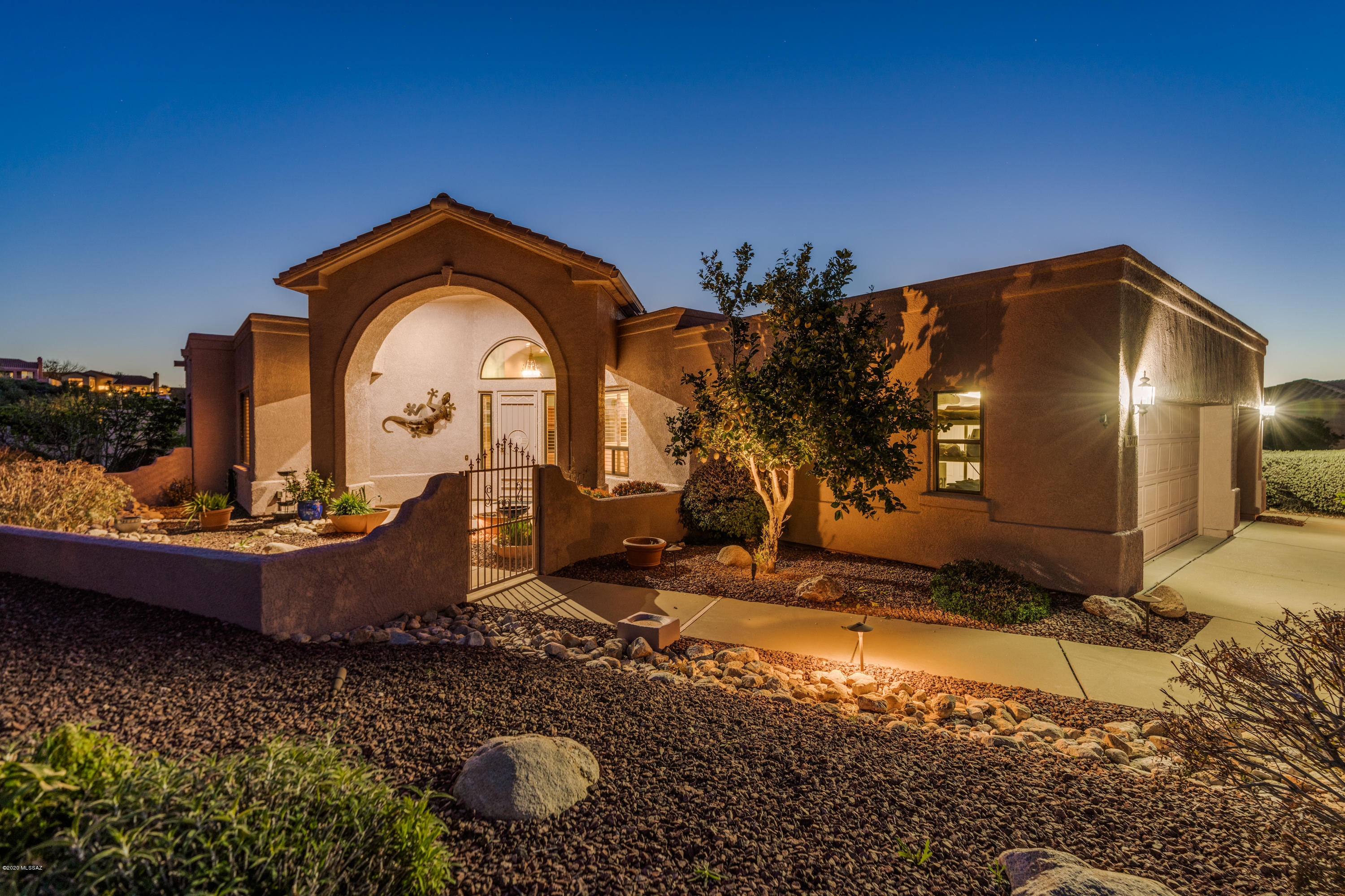If you're looking for a home with views from every room, then welcome to Alder Spring Drive. Pusch Ridge is just outside your door.  Not only will your senses be filled with nature, it will be filled color and delight throughout this professionally designed home. As you walk through the front door, you have a sense of space and look right through the great room to see the custom stained glass window sparkling towards the back patio.  This spacious 2 bedroom, 2 bath home has been thoughtfully updated with quality cabinets in the kitchen, silestone counters and fabulous pull-outs providing lots of extra storage.  The master bath has also been updated as well with a spacious new walk-in shower with beautiful teal tile scattered throughout, then walk through to the walk-in closet with added light by a solar tube!  Enjoy dining with Pusch Ridge providing the entertainment of an array of colors from the setting sun. Custom built-ins provide more than enough work space in the office, with those magnificent views of the ridge again!  All rooms are fitted with custom plantation shutters throughout this stellar home.  The owner took meticulous care of this home.  The 3 car garage offers storage and work benches around the perimeter.  The plumbing has also been replaced, so no poly pipes! Everything has been well thought out to enjoy southwest living inside and out on a true entertainer's patio overlooking the city lights below. The easy care natural and native vegetation are just like jewels dotted across the spacious lot. Easy, single level living in Oro Valley, and plenty of parking on the property.  Dining and shopping are just minutes from your front door. The keys are waiting for you!