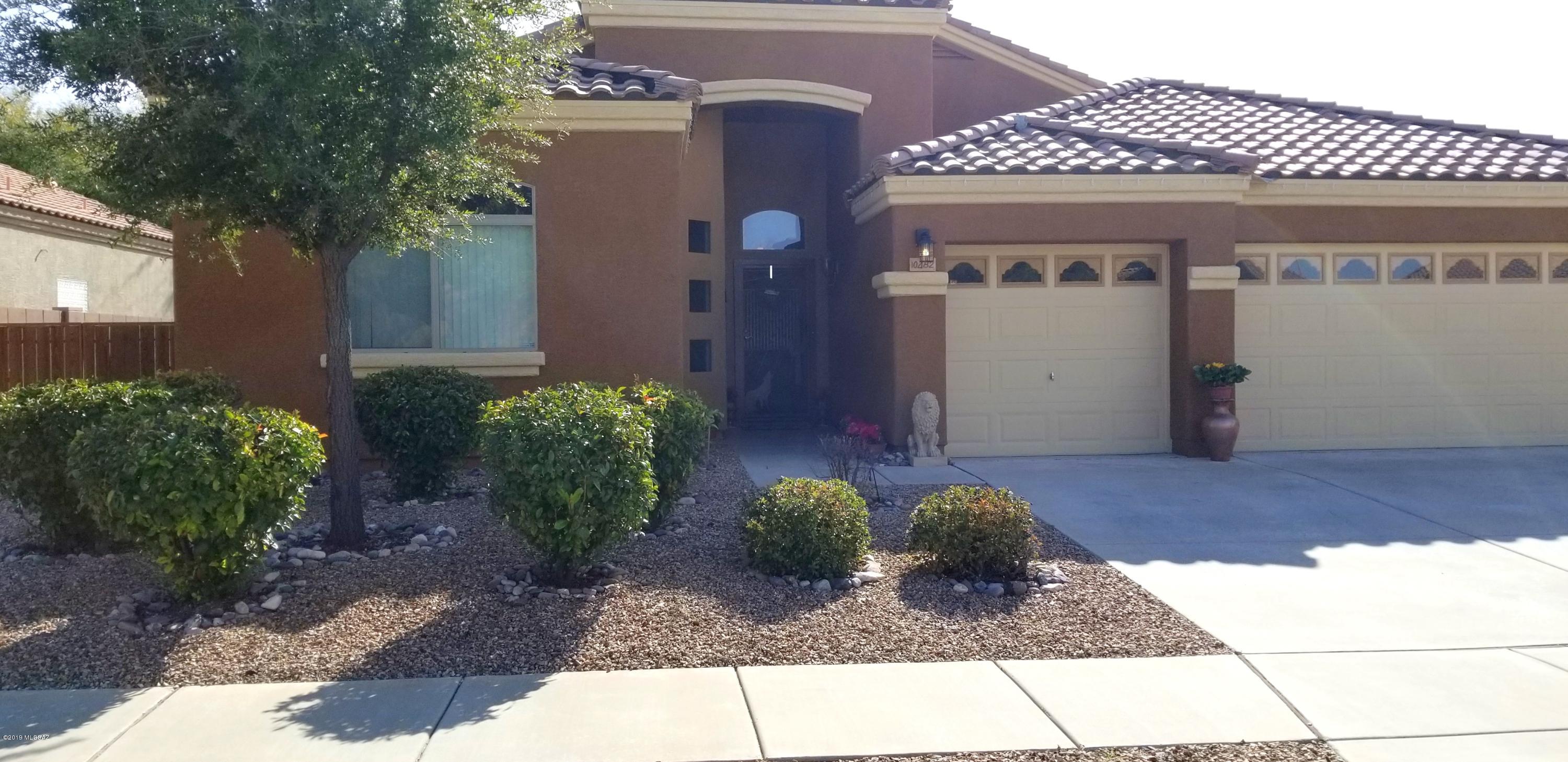 Pride of Ownership is abundant in this Beautiful home that features many designer touches and recent upgrades (Details attached) Nice 4BR/2BA, high ceilings and fans throughout! Beautifully appointed kitchen has Stainless Steel appliances, lots of neutral wood cabinetry with lovely pulls, Granite Counters and Glass Tile Backsplash! Breakfast Bar and eat-in area. Large LR and DR, extra media room off kitchen. Easy care Ceramic tile & Laminate flooring. Retractable sunshades off patio leads to 31 foot Sparkling Pool w/Solar Heat, dog run, BBQ for great entertaining. Custom wrought iron screen doors front & back along with a 3 car gar. Newer Washer/Dryer included. Really nice amount of Separation between homes!  Located in Vail School District and convenient to Raytheon, DMAFB and Comm. Park