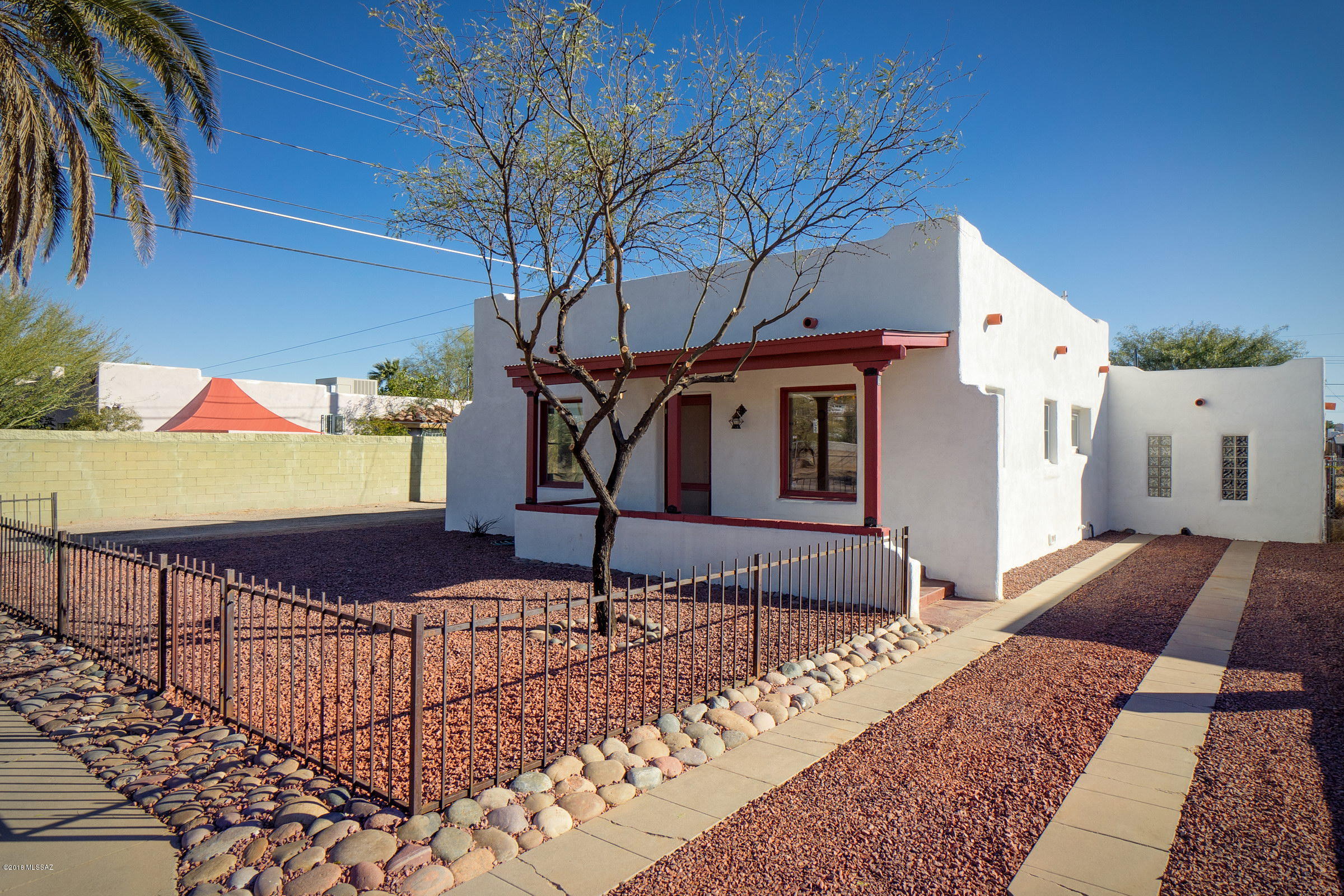 Just west of downtown & only blocks from San Augustin Mercado & a Modern Streetcar car ride from the U of A! This 1930's classic Menlo Park wood, saltillo & stained concrete flooring - no carpet! At the base of A Mountian this home is convenient for any lifestyle! 2 large living areas allow for variety of uses. Enjoy a private fully fenced back yard. Washer, dryer, refrigerator, dishwasher, gas stove, oven, disposal all included. The home has stainless steel and butcher block kitchen counter tops & vintage cabinets. Light, bright windows with blinds and shades, paved area for outdoor entertaining & a small outdoor fireplace. Plenty of off street parking. See floor plan. Garage & Guest house are rented together on separate lease for $750. Landlord is licensed Realtor in Arizona. Photos Soon