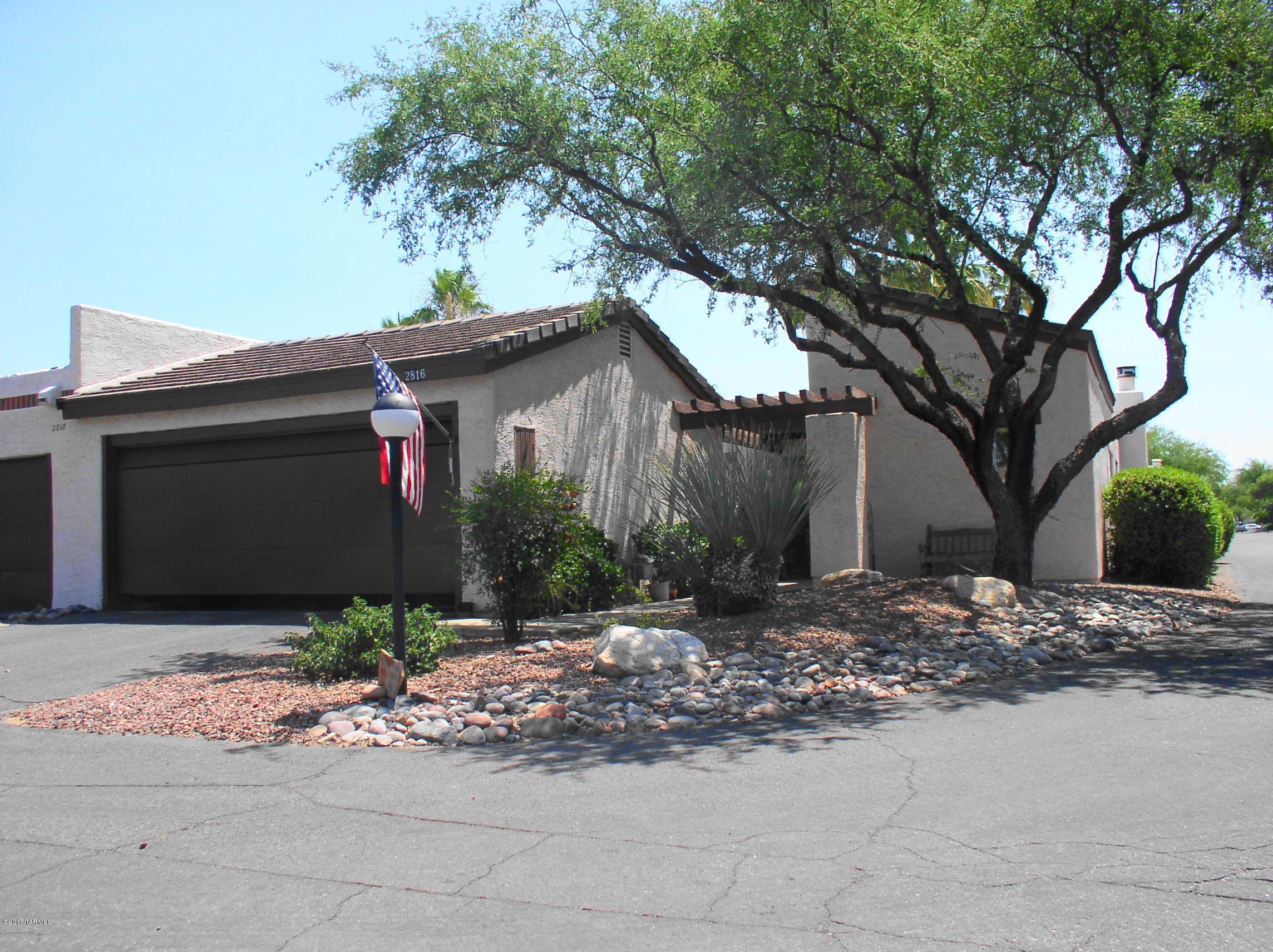 Updated, spacious townhouse. Formal living & dining rooms w/ wooden shutters & high ceilings. Kitchen has white wooden cabinets, 2 pantries, granite counter tops & opens to family room w/fireplace. Split bedroom plan all w/walk-in closets. Master bedroom opens to large brick patio & pool area. Ceramic tile floors through out w/carpet in bedrooms & living room. Patio gate opens to sparkling pool & large ramada. Double car garage w/storage. Home is located on corner lot, backs to common area & pool. Owner/Agents pays monthly HOA Fee. Close to shopping, restaurants, Banner Hospital, U of A & within walking distance to the Tucson Racket Club & River Walk.