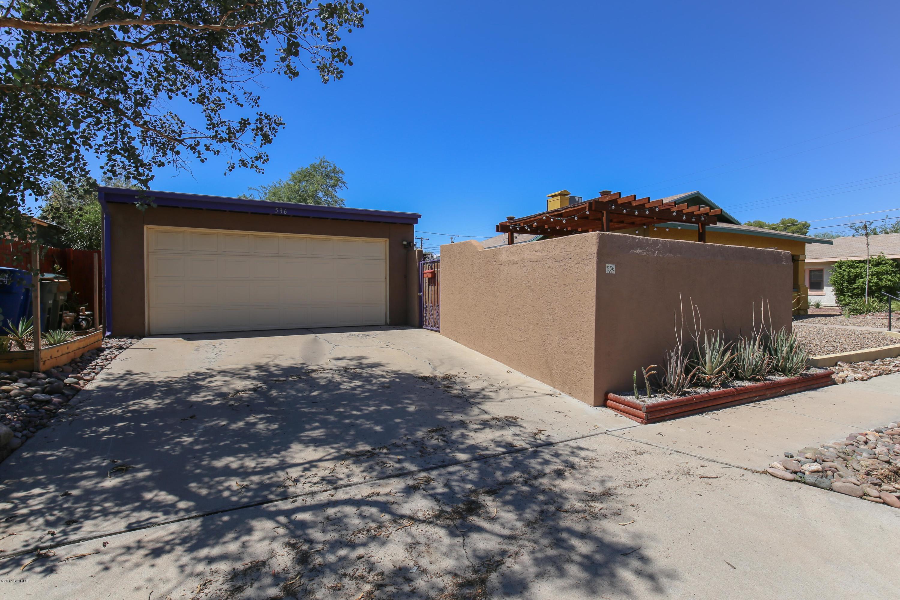 Central location. Close to U of A and the convenience of everything in Central Tucson. Tile and Pergo flooring for easy maintenance. Skylights provide for natural lighting through out the house. Enjoy central AC in the summer and a toasty fireplace in the fall. Spacious bedrooms with large closets. All appliance including washer and dryer. Two car garage along with driveway for parking. Security doors, fenced yard and window bars. Small dogs ok. No undergrad students.