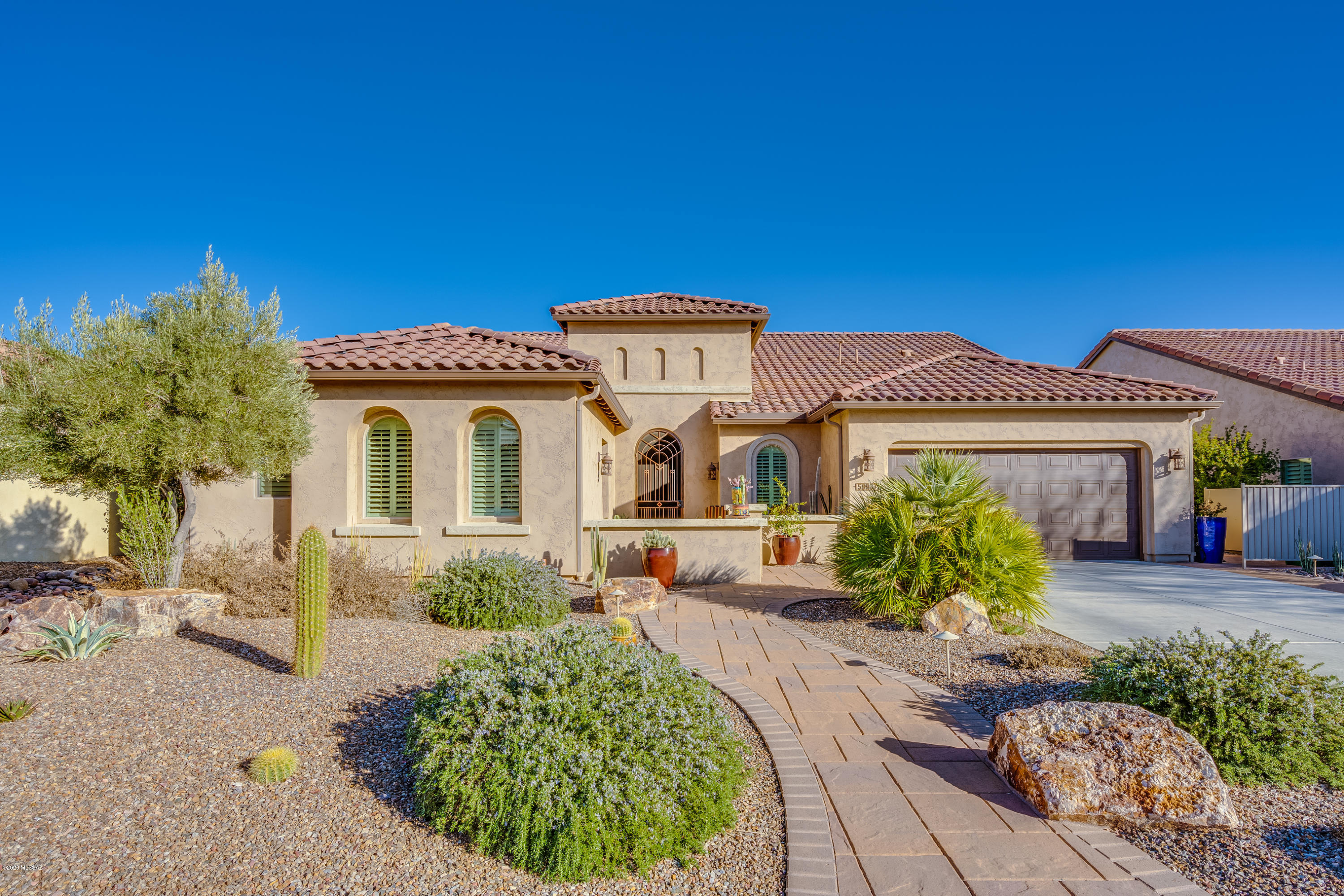 PANORAMIC VIEWS on Coveted Ankole Drive in Saddlebrooke Ranch! One of the Top PREMIUM Lots with a gorgeous 3 Bed + Den & 3.5 Bath Home.  TONS OF UPGRADES Including newly REMODELED kitchen w/ high end appliances(Refrigerator 2019), professionally landscaped w/ fountain, push button screens, window coverings include plantation shutters. Dynamic Tile Flooring w/ newer carpet in the bedrooms. Master Bath w/ Tiled wall dual vanity area.  CASITA w/ Built In Murphy bed, desk area and Bath w/ Walk In Shower. Extended 2 car + shop garage that could be converted to 3 doors. Don't wait to build on a lesser lot!