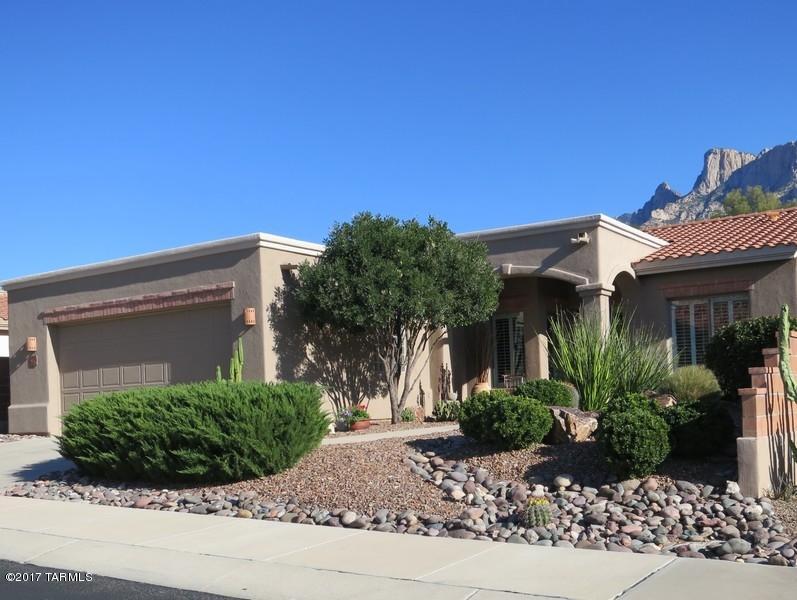 Masonry construction * Semi custom * Gated community of La Reserve, Oro Valley * E-SE exposure, with mountain view, on quiet cul- de-sac * 3 bedrooms, one of which has custom office system that includes a queen sized Murphy bed * 2 baths - master bath has separate shower and soaking tub. Both baths have 2 sinks * Large windows with plantation shutters, very light and airy * Upgraded lighting throughout * Many skylights, vaulted ceilings * Open concept * White kitchen cabinets with quartz stone counter tops * Dining area + breakfast nook * Stainless kitchen appliances * Gas fireplace in living area * Tile floors except for bedrooms * In-ground spa with waterfall, flagstone patio, great for entertaining * Natural gas fire pit * Natural gas barbecue * Ambient outdoor lighting.