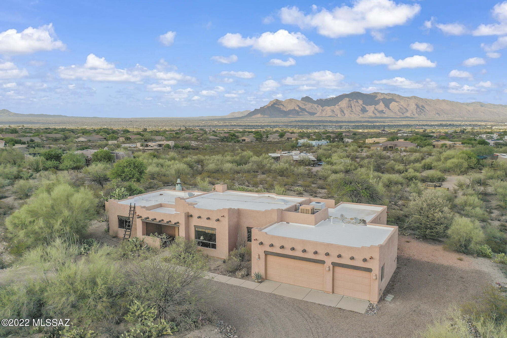 Breathtaking 360 degree mountain and city views are yours from this custom Santa Fe style ranch home with 4Bdrms/2.5BA and all on 3.35 acres! Spacious open floor plan has huge Great Room w/beehive fireplace and soaring cedar-planked ceiling. Additional Family & Dining Rooms give you that extra space you desire. Tile & wood floors throughout. Custom Kitchen has island with gas cooktop, granite countertops & hand-stained cabinets. Roomy Primary Bedroom has en suite with garden tub, separate shower and walk-in closet. Enjoy entertaining in the delightful back yard featuring a Kiva Fireplace, built-in BBQ, Coy pond, hot tub and an expansive veranda to take in the fabulous views.