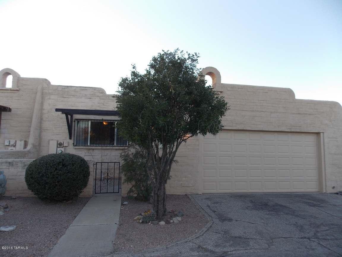 Terrific centrally located townhome, nicely setback from the street and gives you a sense of privacy in the middle of town. This two-bedroom townhome has great detailing with a new kitchen with IKEA cabinets, granite counters, new stainless appliances and stainless tile backsplash. Remodeled baths with new flooring, vanities, and fixtures. New A/C unit 2015, hot water heater was re-plumbed 2015. Nice open floor plan a plus for entertaining and a spacious backyard and courtyard entrance. This townhome is move-in ready. Convenient to Tucson Mall, stores, and shopping. Call for your private showing.