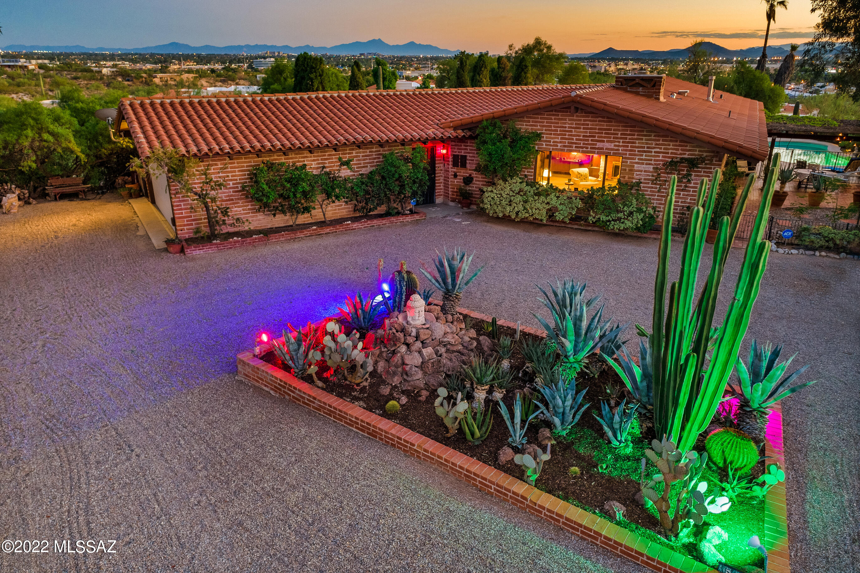 OPEN HOUSE SUNDAY 11/27 1-4 PM!!! Once in a very long time, you have the OPPORTUNITY OF A LIFETIME! Welcome home! This spectacular, mid-century modern home is ONE OF A KIND Nestled on a prime view lot showcasing panoramic city and mountain views, you will enjoy unrivaled privacy and connection with the natural world! This home and setting are truly a sanctuary of peace and tranquility! Even the soaring trees whisper an energy of grace in this serene setting! As you arrive, you are greeted with curb appeal galore and distinct pride of ownership! Inside, tons of natural light and soaring, tongue and groove ceilings provide an authentic welcome and a feeling of home! The kitchen is era appropriate with charming details and cool tones overlooking backyard bliss! The primary suite is expansive with spa like bathroom and walk in closet! Don't miss the fragrant gardens, flagstone patio, Arizona room, and sparkling pool with endless views! Moments from Tucson's finest amenities and restaurants, this home truly is in the middle of it all but feels A WORLD AWAY! A timeless blending of new and old, of location and design, of function and comfort, this is one of the rare and exquisite offerings that is quintessential Tucson! Lovingly updated with new artisan tile roof, new water line, new gas line, newer hot water heater and more! Oracle Foothills neighborhood is a friendly, walking neighborhood with regular community events and opportunities for connection!