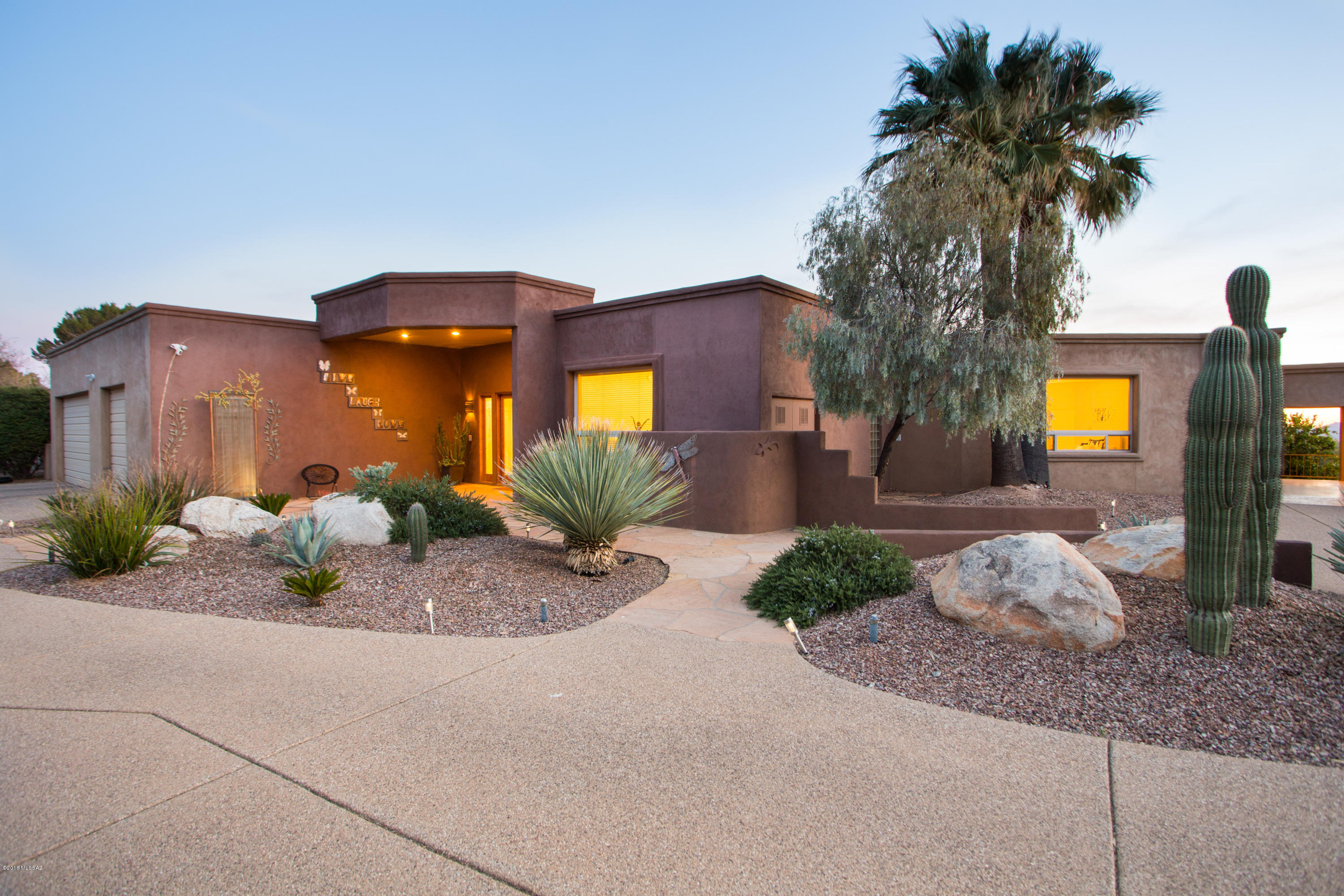 Sophisticated soft contemporary home with clean lines and cozy feel. Interior spaces and outdoor patios flow together effortlessly for gracious living and entertaining. Beautiful materials, open floor plan and wonderful golf course, mountain and city views. Home was rebuilt in 2001 from fireplace wall up, with soaring ceilings, no interior steps, travertine floors, and walls of windows for views and light. Additional updating in 2015 by current owners. Master bedroom suite with 2 walk-in closets opens to patio/pool/spa, Gourmet kitchen with granite counters, center island, S/S appliances. 3 additional bedrooms with en suite baths in main house, plus Media/Game room. Large wrap around backyard with built in BBQ, sep guest house w/bdrm & bath, CFSD schools.
