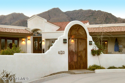 Five bedroom southwestern style, 4622 sqft fixup on highly secluded 1.21 acre private lot on a cul-de-sac in prestigious Alta Vista in the Catalina Foothills. Bring your imagination to see how you would update this expansive home that includes an additional approx. 1009 sqft studio above the three car garage. Adjacent to dedicated open space desert, the open flowing floor plan offers courtyard entry w/hacienda feel, five covered porches, custom knotty alder entry doors with stained glass, rustic imported Italian tile floors, beehive fireplaces in FR and patio. Large eat-in kitchen w/island, breakfast nook and bar. Could have 3 master suites. Pool/spa, numerous play and entertainment areas and much more. Being sold strictly as is, subject to inspections.