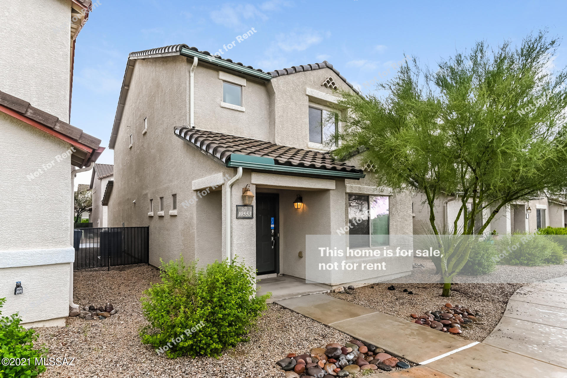 This Tucson two-story home offers a two-car garage.