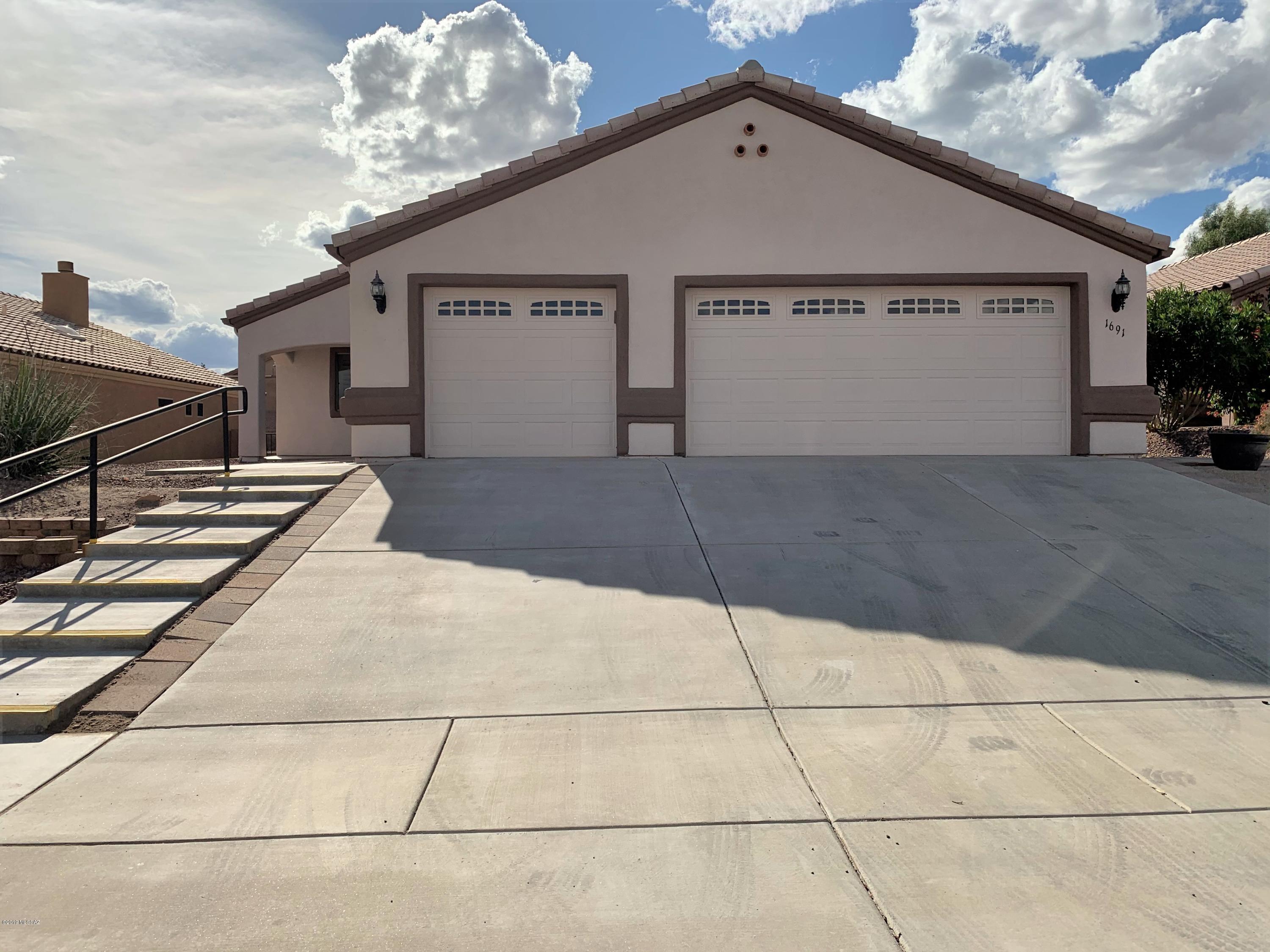 This meticulously maintained home will impress you the moment you walk in the front door. Your eye is immediately drawn to the beehive gas fireplace in the great room along with the soaring ceilings. With warm neutral paint, tile flooring throughout, extra recessed lighting and an open concept, this home is sure to make an impact. The large master looks out over the private back yard. The split bedroom floor plan allows your guests a private room and bathroom area. In addition, a 3rd bedroom can be utilized as an office or den. Step outside to the covered porch with extended patio pavers and enjoy the mountain view while soaking up the Arizona sunshine. The home does NOT have GVR, but it is available if the new buyer would like to opt in. Come see this amazing home today.