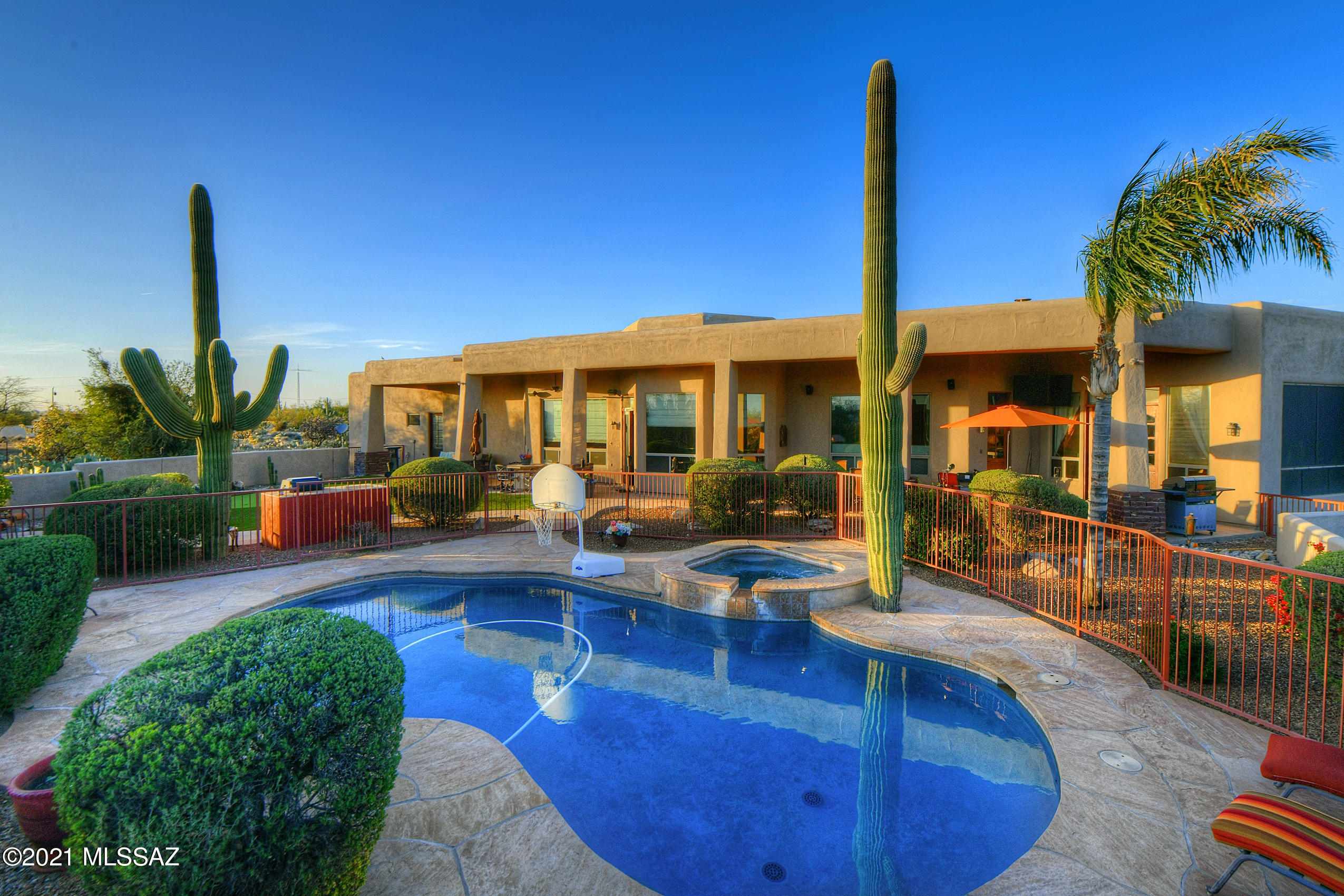 Wow! Luxurious 4,293 SF Coronado Custom home! 5 bed, 3 bath perfectly designed home with all the best features! Split bedroom floorplan w/high ceilings, wood beam accents and upgrades galore! $100K Knotty Alder Custom Door package.  Kitchen is a chef's dream with commercial grade features! Wolf and Viking appliances, granite countertops, 48'' 4 burner gas range with integrated 22'' flat top grille and matching vent hood, commercial sized Viking counter-depth fridge, double ovens, island prep sink plus wrap around bar seating.  Watch the sunset from the show stopping backyard w/custom heated pool and spa, outdoor fireplace, covered patio, fire features, flagstone patio and your own private putting green. Owner's retreat has huge master bath and walk in closets!  $25K paver wrap-around driveway leads up to the oversized 3 car garage which boast 3 additional storage rooms plus an attached single car carport for your extra toys!  Dual newer, highly efficient 16 SEER AC heat pump systems.  This beautiful home sits on a spacious 3.31 acre, highly sought after SR zoned lot which allows for horses and additional structures!  This home truly has it all!  Don't miss out on this one!
