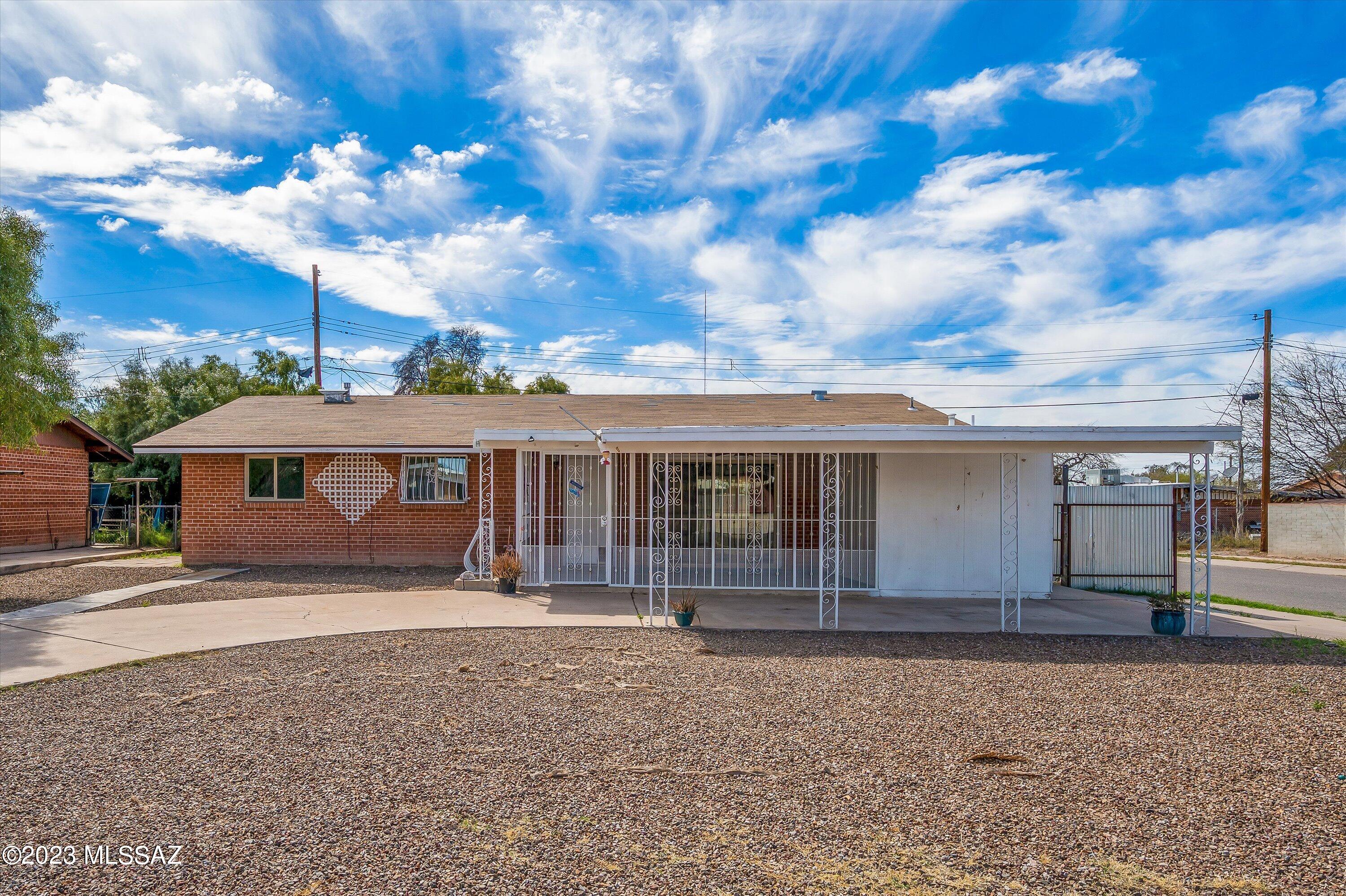 This Brick Bungalow on a Corner lot is 1293sqft property has 4 bedrooms, and 2 bathrooms. Kitchen contains gas oven, granite countertops, and white appliances and opens to an Arizona Room. The back yard has covered patio and pool with large oleanders surrounding it. Laundry Room and lots of space for storage. Please check out the floor plan. Conveniently located to Centennial Elementary. Come Check it out!