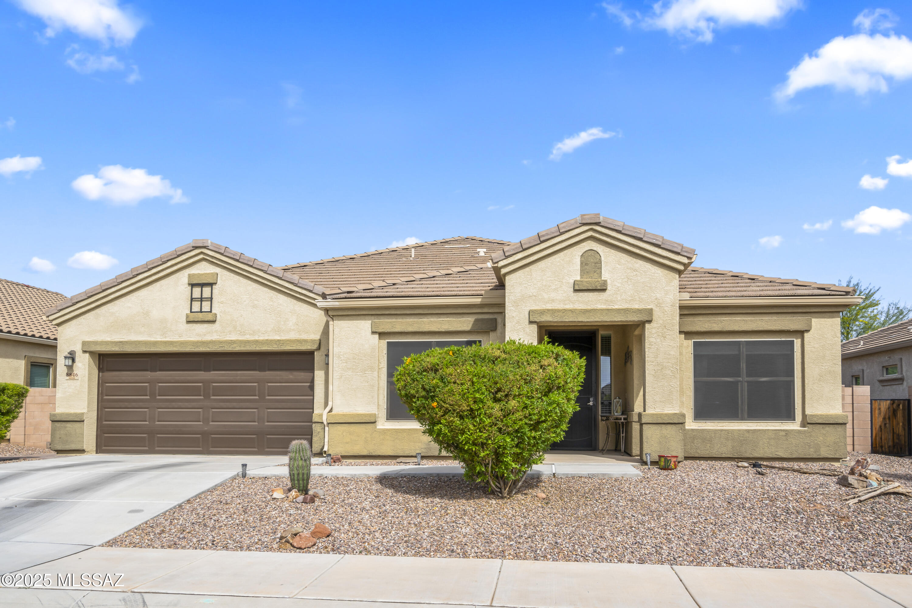 If you want everyday to feel like a vacation, then you need a home with a backyard oasis, and this is the one! This home is part of a 55+ community inside of Saguaro Bloom and has so much to offer. The custom-designed backyard is a true sanctuary, perfect for relaxation or entertaining. Picture yourself unwinding by the warm glow of the gas fireplace, preparing delicious meals in the outdoor kitchen, or savoring the soothing sound of the waterfall feature. With elegant pavers, mature landscaping, and a putting green for leisurely afternoons, this outdoor space is nothing short of remarkable. Inside, the home is equally impressive, boasting an array of upgrades that combine elegance and functionality. The kitchen features extended cabinetry, quartz countertops, a stunning backsplash, a reverse osmosis system, a walk-in pantry, and stainless steel appliances. Each bedroom comes with its own en-suite and spacious closet, offering both comfort and privacy. The primary suite connects seamlessly to the laundry room, which is equipped with beautiful cabinetry and a sink for added convenience. The den provides a versatile bonus space, complete with a closet and the potential to be transformed into a third bedroom. The garage is a standout, featuring epoxied floors, storage cabinets, and a split AC unit, making it a comfortable and practical space. Beyond your home, the Saguaro Bloom community boasts incredible amenities, including walking and biking trails, parks, pools, a splash pad, a gym, and a community center. This property truly offers resort-style living at its finest. Don't miss your chance to own this desert oasis. Schedule your showing today and make your dream lifestyle a reality!