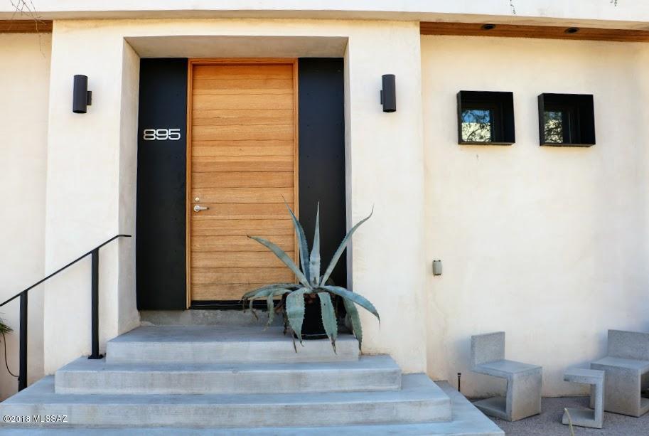 Stunning architect-designed modern contemporary home in the Mercado. Soaring ceilings,spacious two story, 3 bedroom 3 bath, two office/flex spaces, on double lot, builder's own home.  Only home in the Mercado District on a double lot with a sparkling pool! And a gorgeous enormous mural of Diego Rivera and Frida Kahlo, by local artist Rock Martinez.