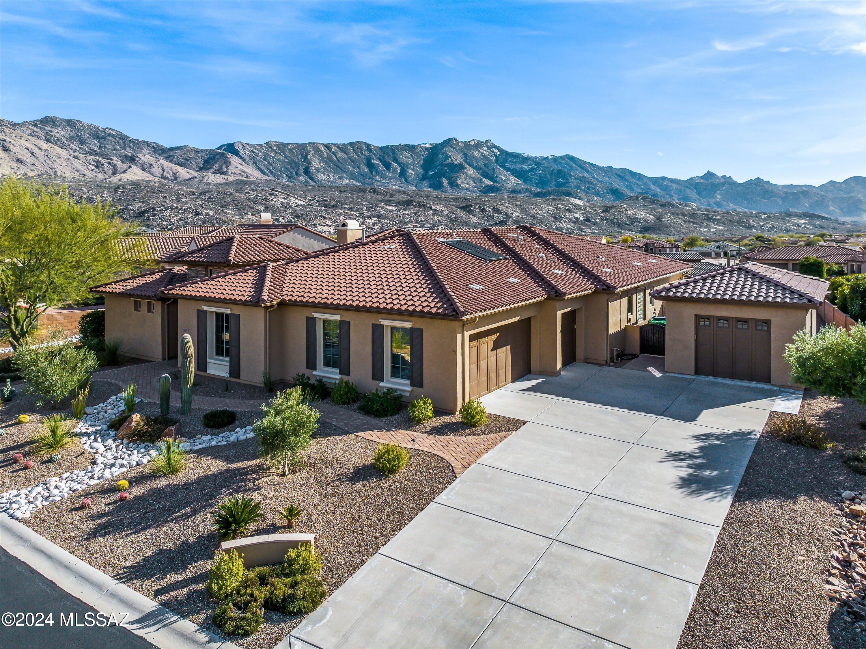 Dramatic south eastern facing mountain views from this highly impressive 3725 square foot Sonoran Model in The SaddleBrooke Preserve! Remodeled in 2022, this home boasts features that make it distinctive, yet extremely livable. Highlights include gourmet island kitchen with granite counters, alder cabinets, stainless appliances, built-in buffet, farmers sink & walk-in pantry. Additional features include large detached garage, AZ Room with limestone flooring, natural gas fire pit, coyote proof dog run & spacious casita. Many windows have electric shades inside & out. Complete office with integrated Murphy bed & expansive storage features. Hallways, kitchen & master closet have solar tubes which brings in natural light. Phenomenal mountain & sunset views complete this excellent value!