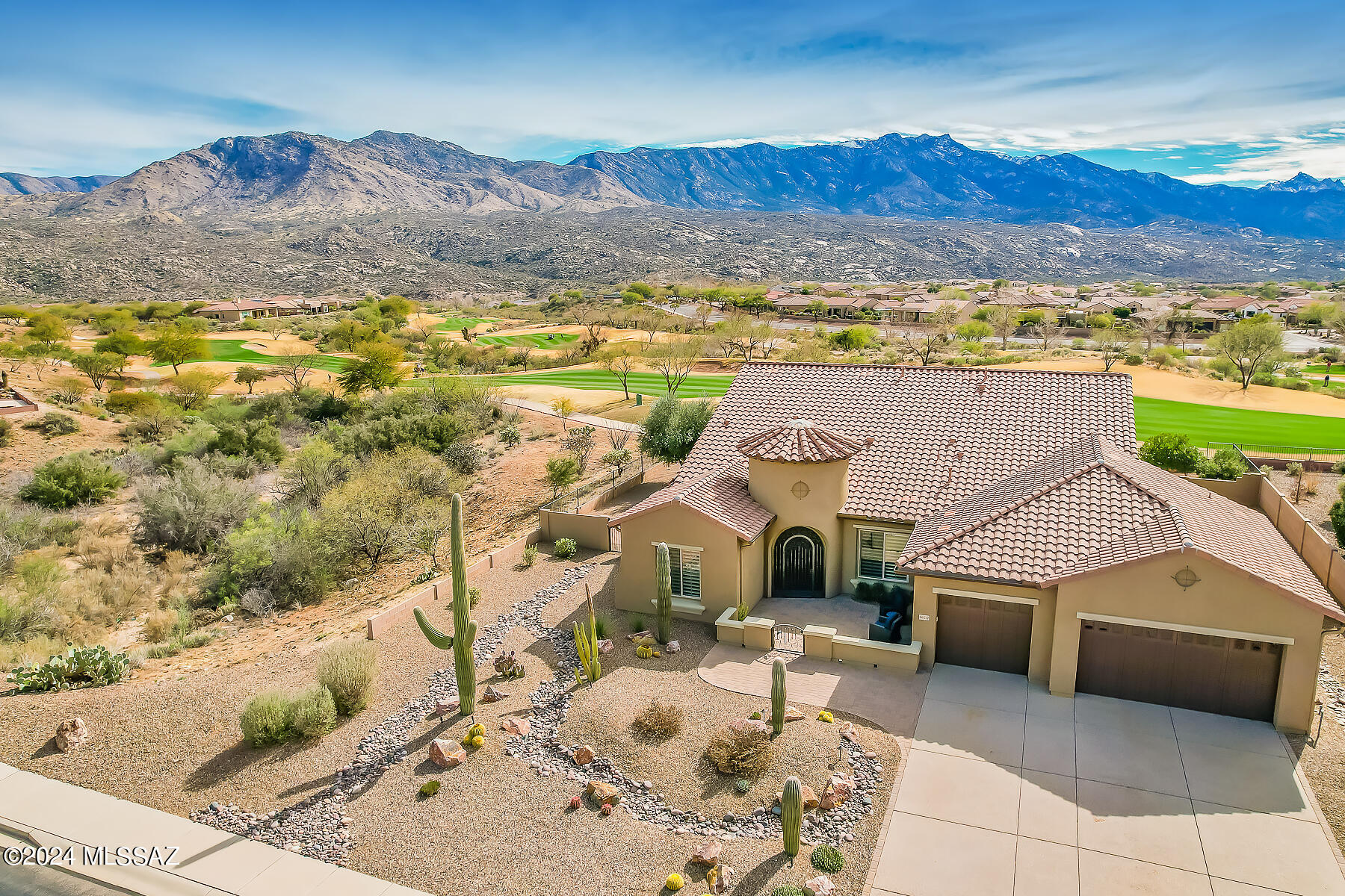 Spectacular desert living on golf course affords panoramic mountain views from inside & out. Amenities galore include dual en suite bedrooms, Great room, Family room and Den in this 2,648sf luxury home. Inviting gated paver courtyard flows to Great Room with view windows, large dining area plus gourmet kitchen hosting center island, in-wall ovens/gas cooktop, granite counters & SS appliances. Owner's suite with bay window & patio access hosts luxury bath w/ dual vanities, soaking tub, walk-in shower & closet. Front guest room w/ en suite bath + powder room. Extended laundry & 3 car garage w/ large workshop. Retreat to a covered paver patio w/ built-in BBQ, remote sunscreens that fully enclose space, and fabulous golf course and mountain views! SaddleBrooke Preserve active adult community.