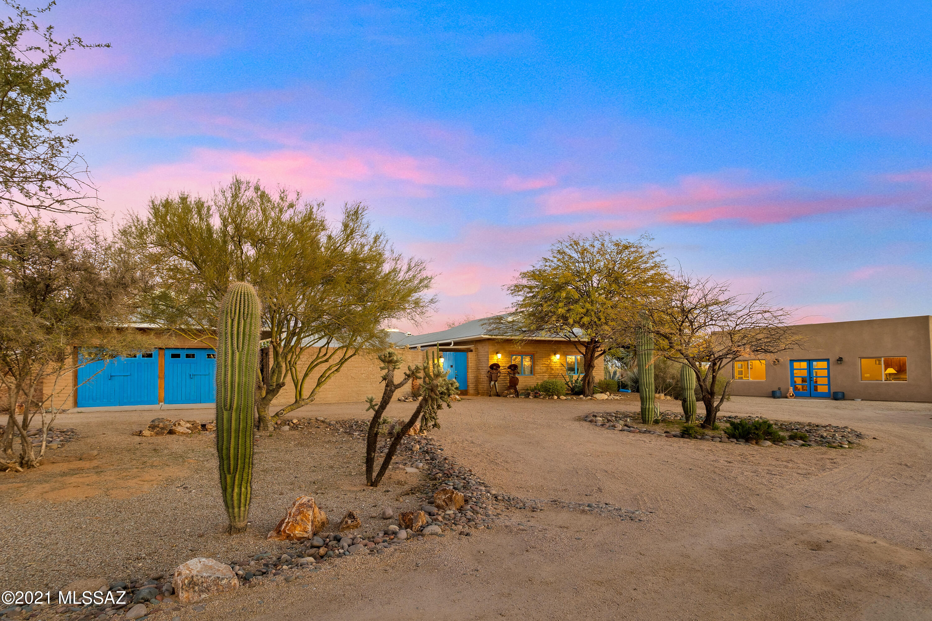 A RARE MUD ADOBE IN ORO VALLEY w/ over 4,436 sq ft including a new 1,100 sq ft guest house!   Price per sq ft at 208 a sq ft is unheard of for Oro Valley Schools & 3.22 acres of PURE PRIVACY & MESMERIZING CATALINA MOUNTAINS VIEWS.  RUSTIC & Truly one of a KIND.  As your enter a true sense of relaxation takes over - a feeling of comfort, warm, spacious with nature all around.  Open & Bright w/ Adobe walls 18'' thick. Parties of over 100 have been held here w/ the bonus a large courtyard, huge circular driveway & 6 car garage, plus perfect positioned east backyard that is currently completely open - owners loved the sense of nature around them - but easy to add a wall around the back (agent has quotes).  Think pony wall, wrought iron, sun sails & a a great game of horse shoes.